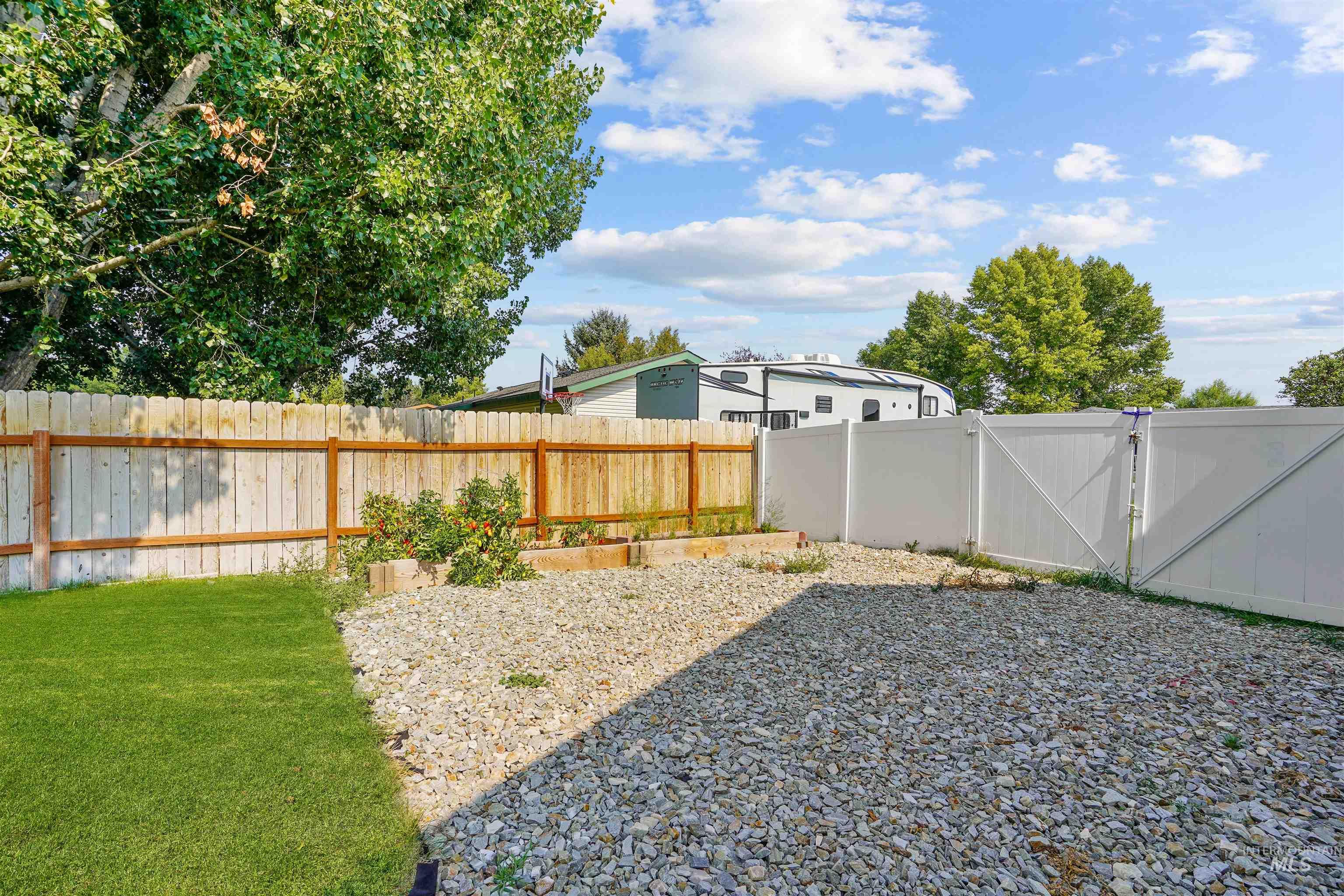 Fenced backyard with a gate