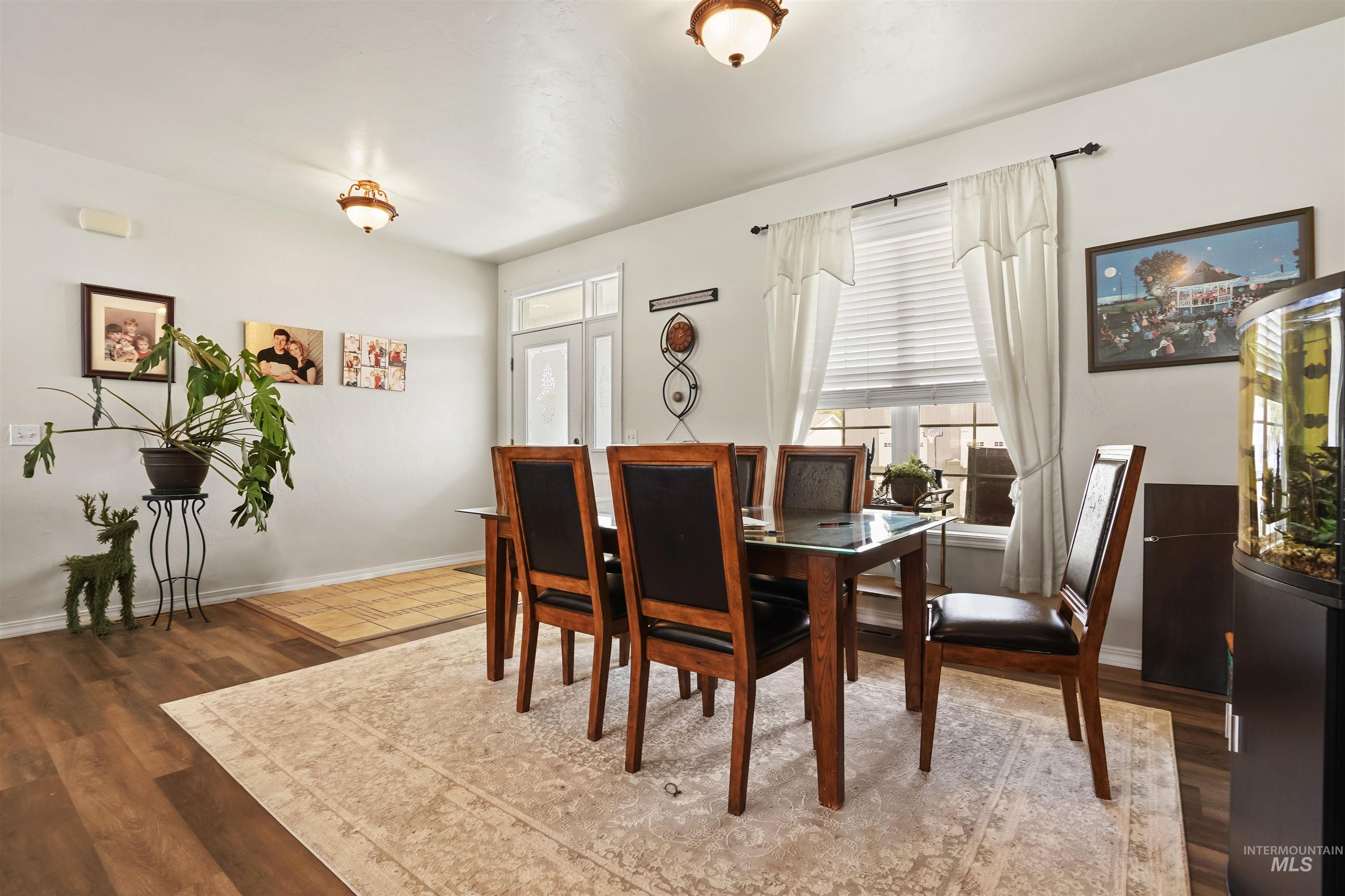 Dining room with wood finished floors and baseboards