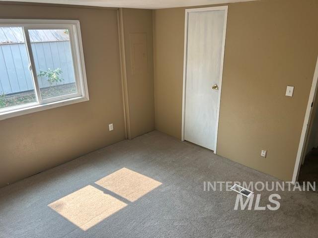 Unfurnished bedroom with carpet floors and a closet