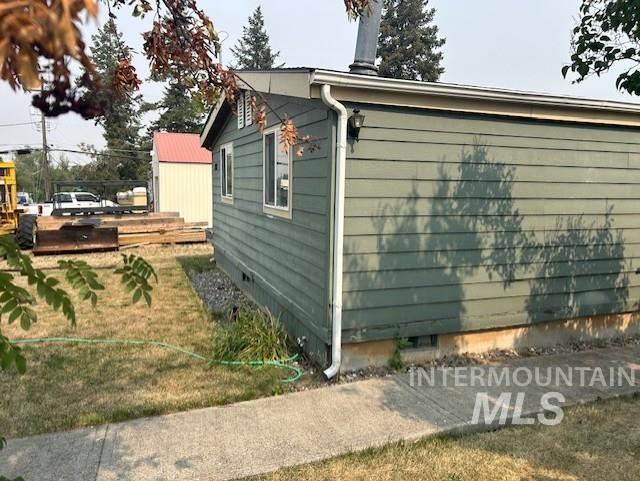 View of side of property featuring a deck