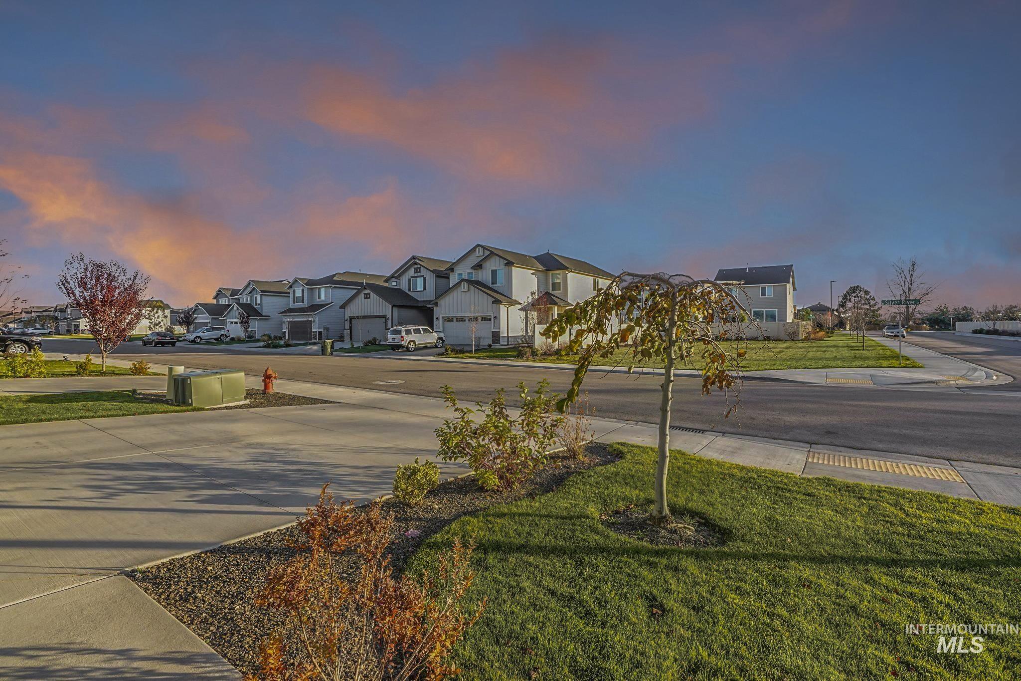 View of road featuring a residential view and sidewalks