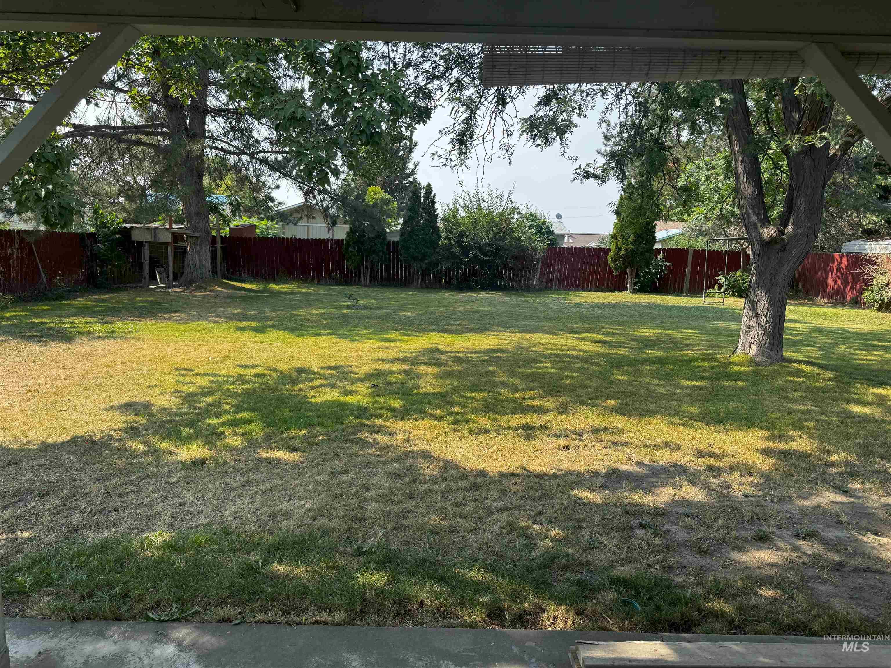 View of fenced backyard