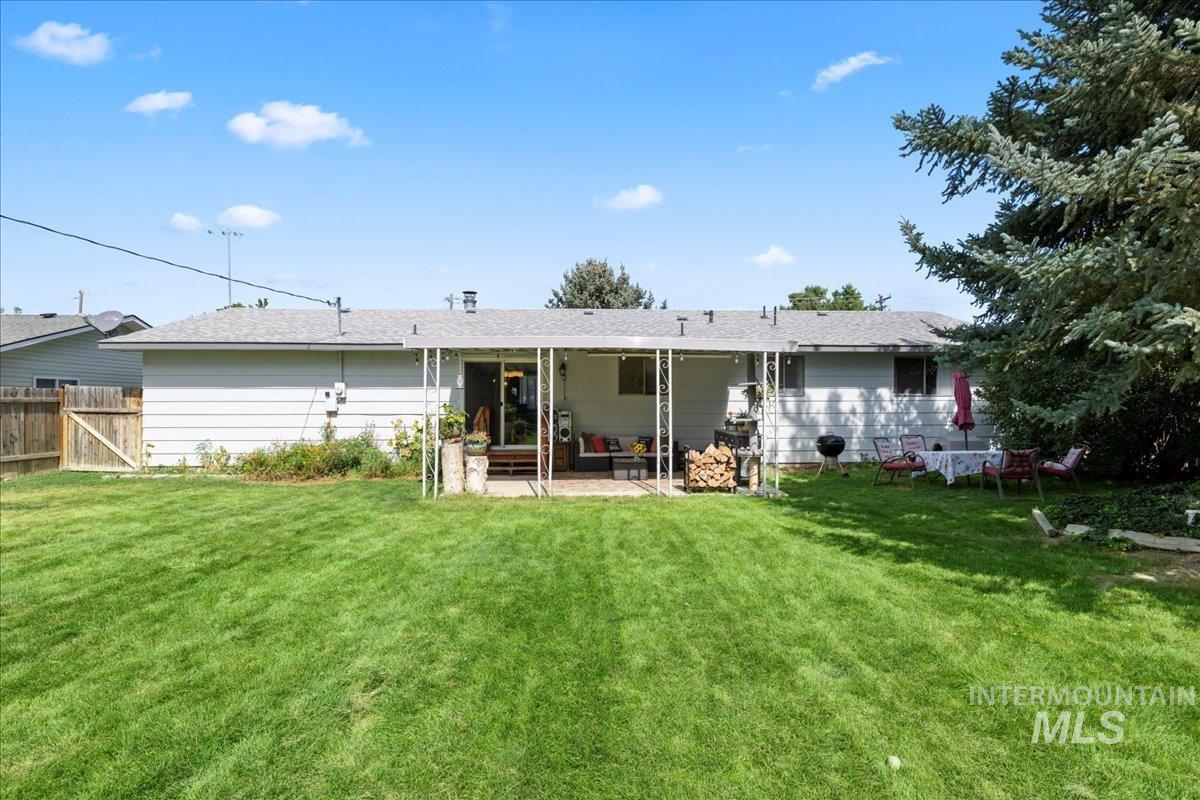 Rear view of property with a patio area