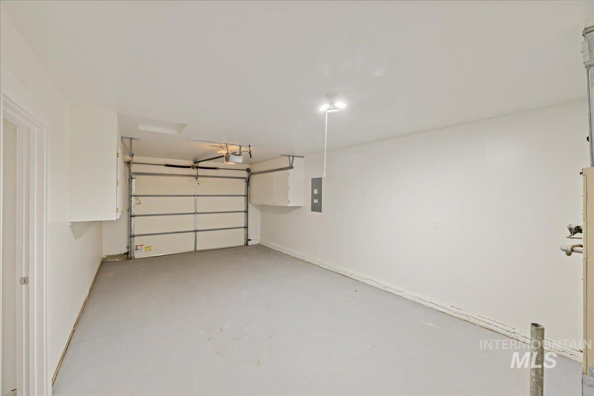 Garage featuring electric panel