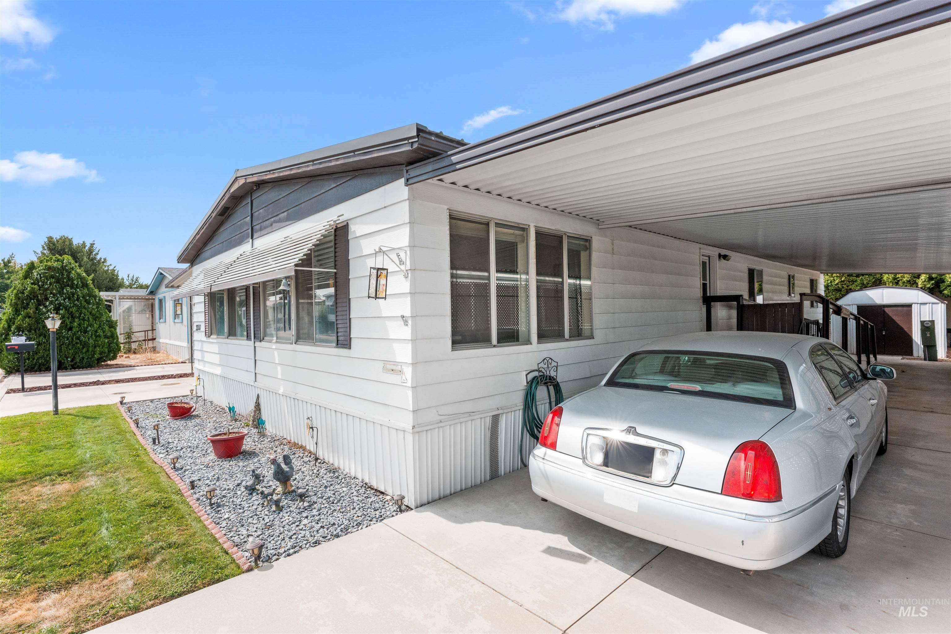View of side of property with an attached carport