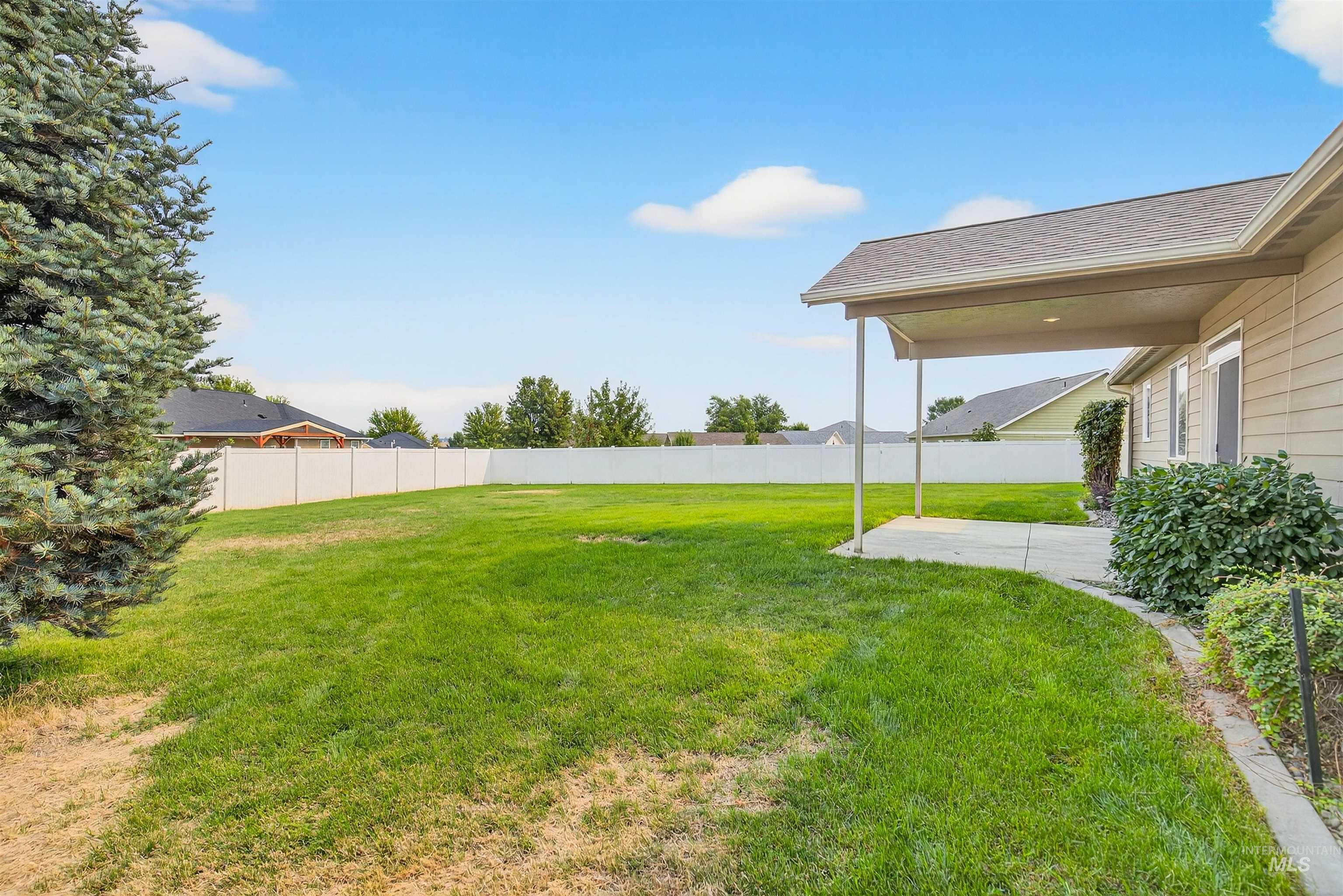 View of fenced backyard