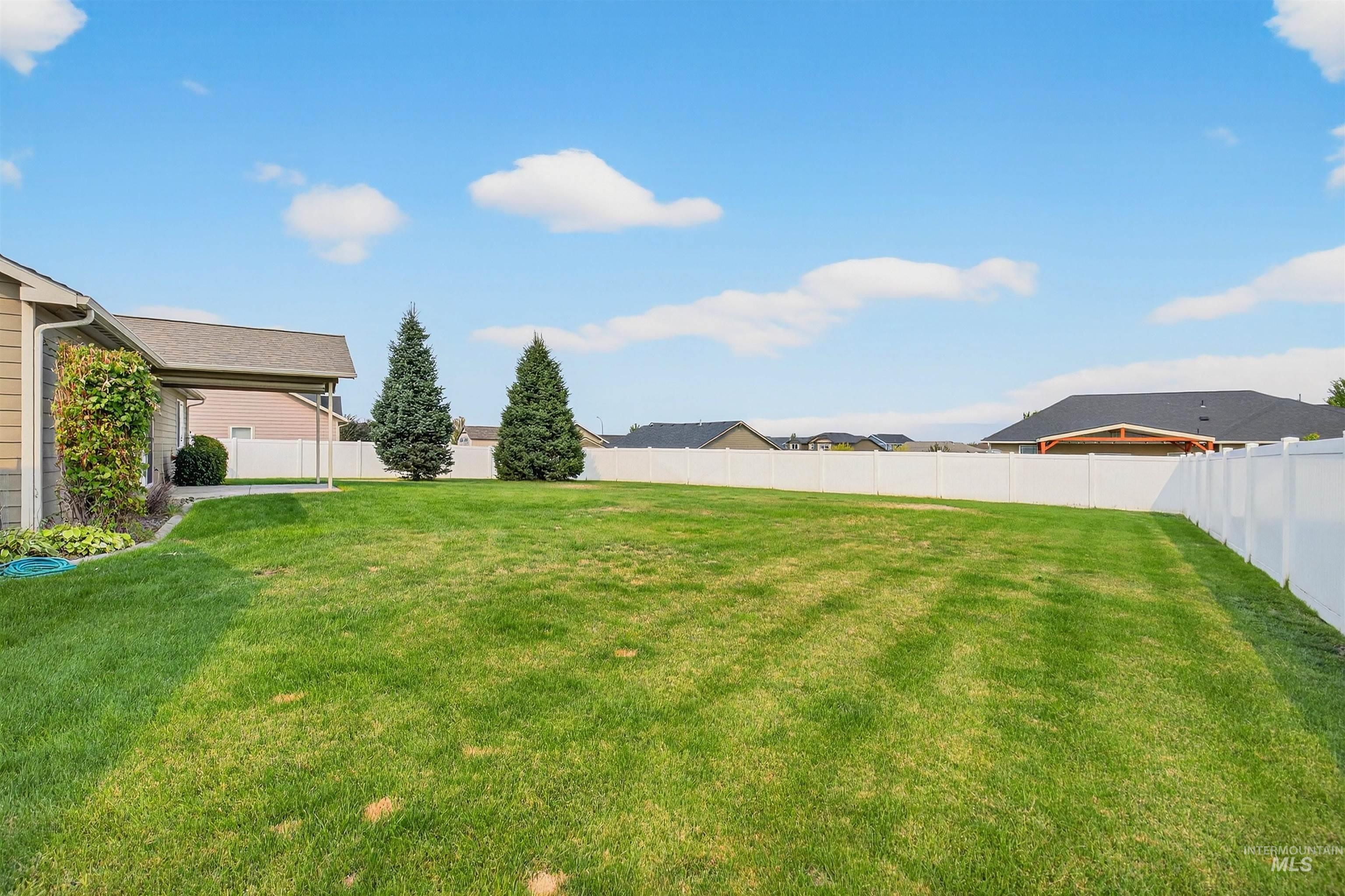 View of fenced backyard