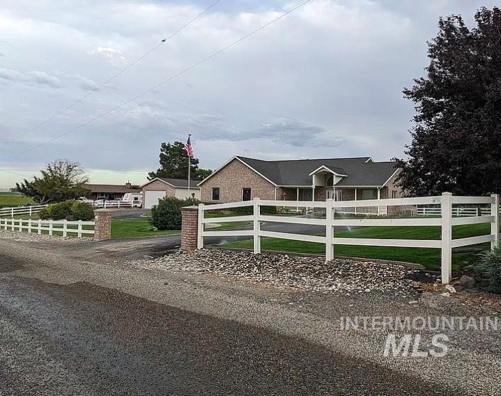 View of front of home featuring a fenced front yard