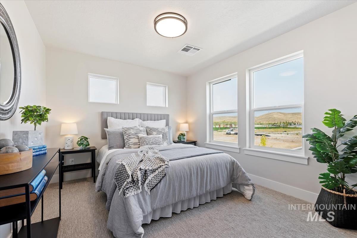 Carpeted bedroom with baseboards