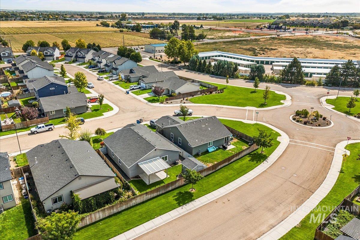 Aerial perspective of suburban area with farmland