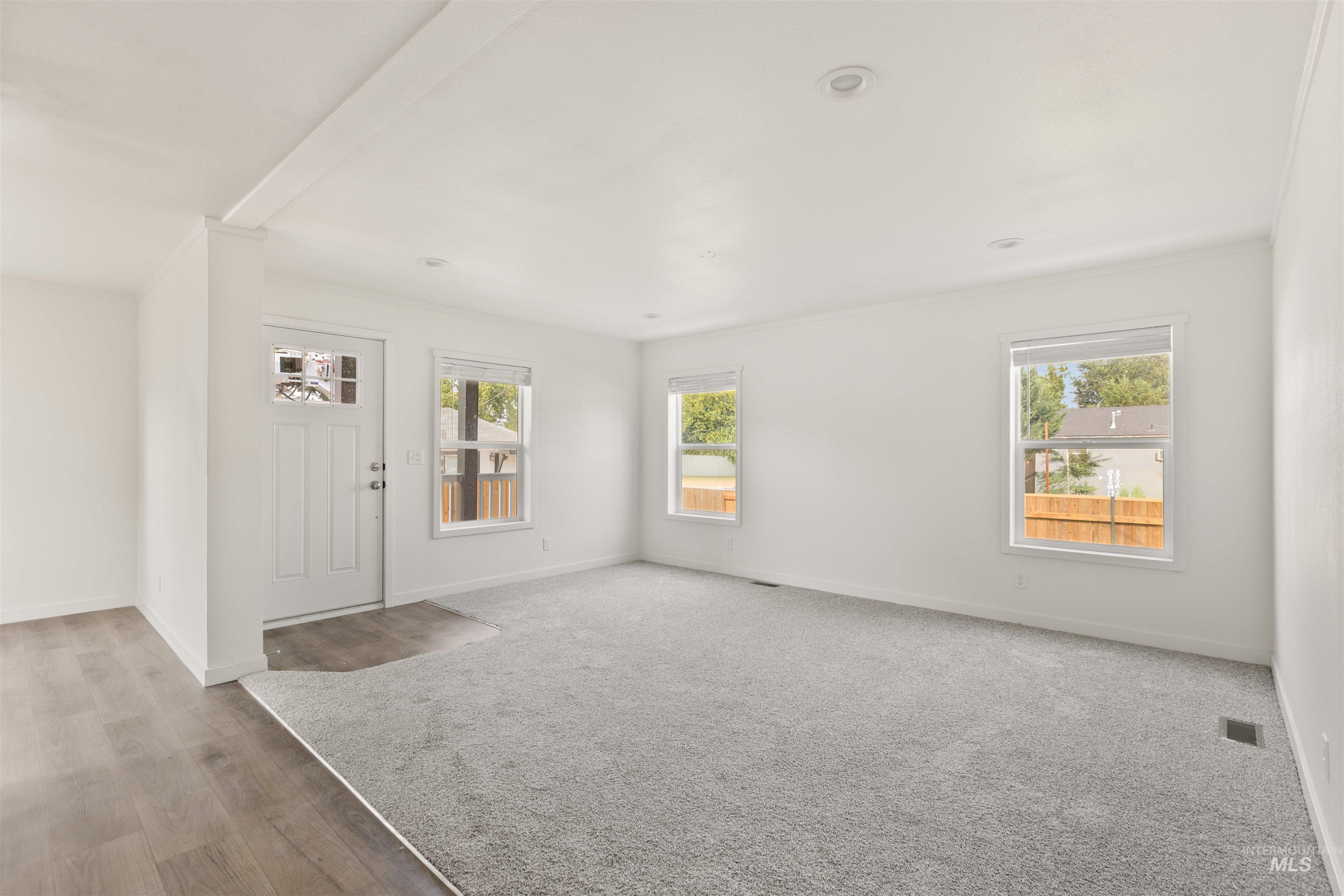 Entrance foyer featuring healthy amount of natural light and light wood finished floors