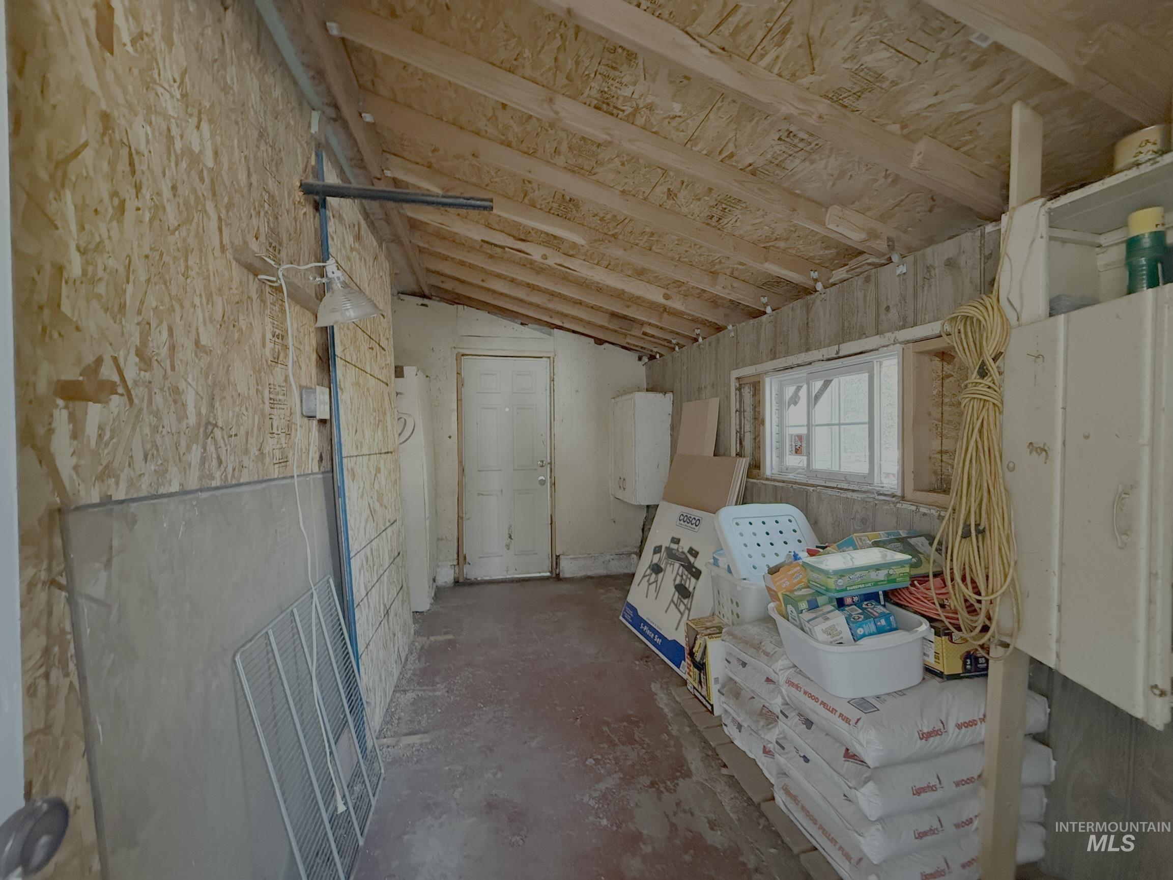 Miscellaneous room featuring lofted ceiling