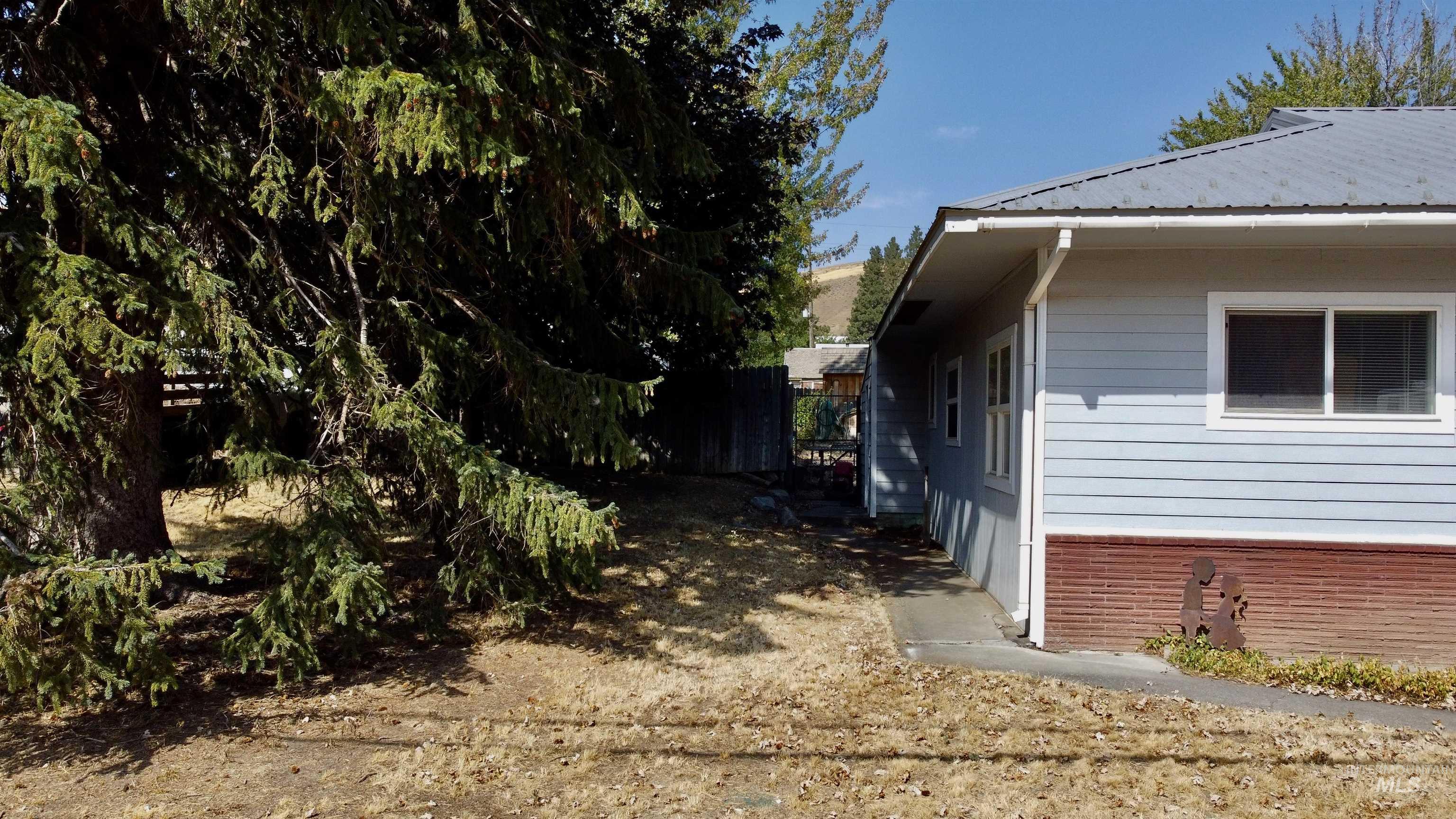View of home's exterior featuring a metal roof