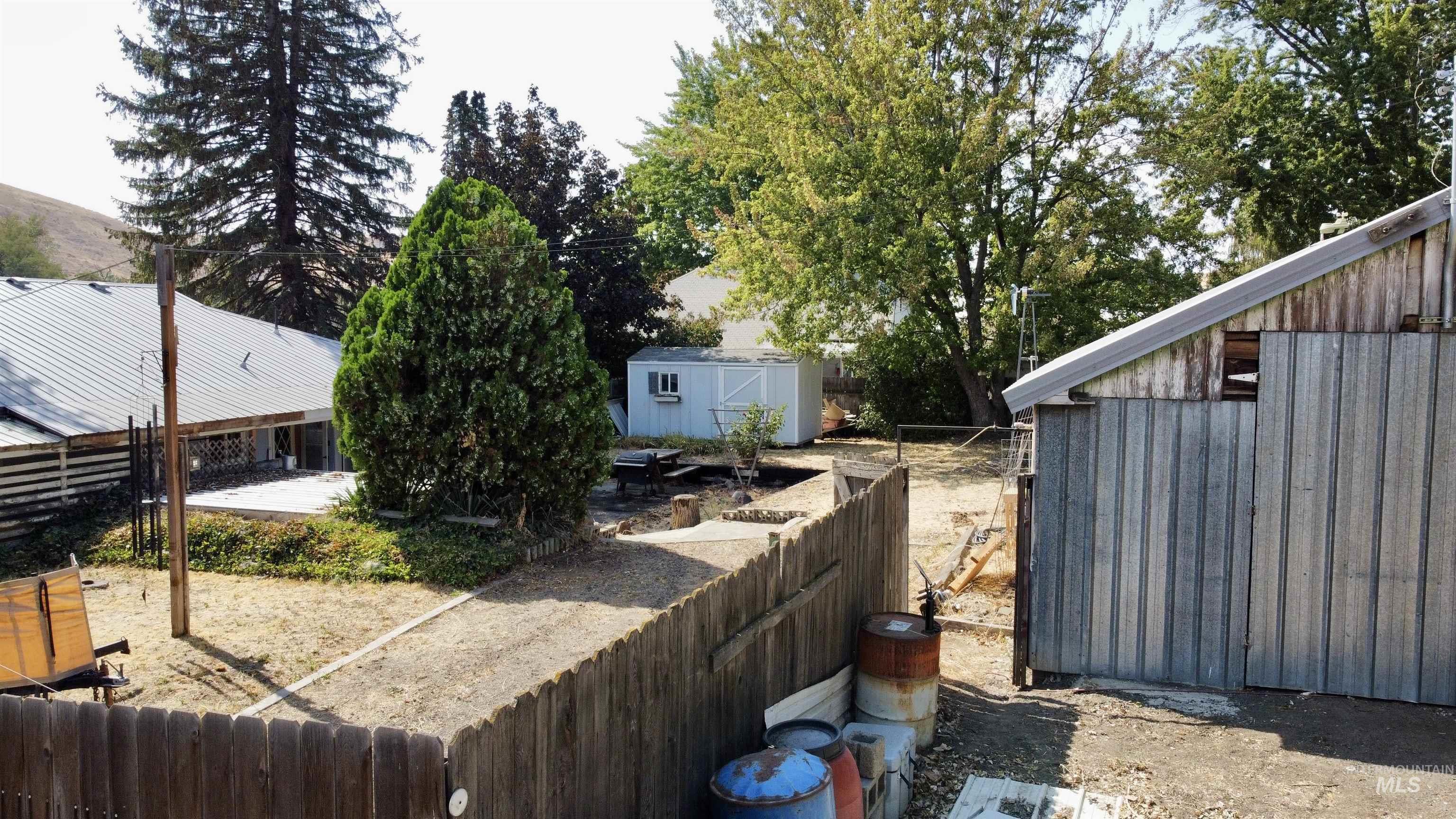 View of yard featuring a storage unit