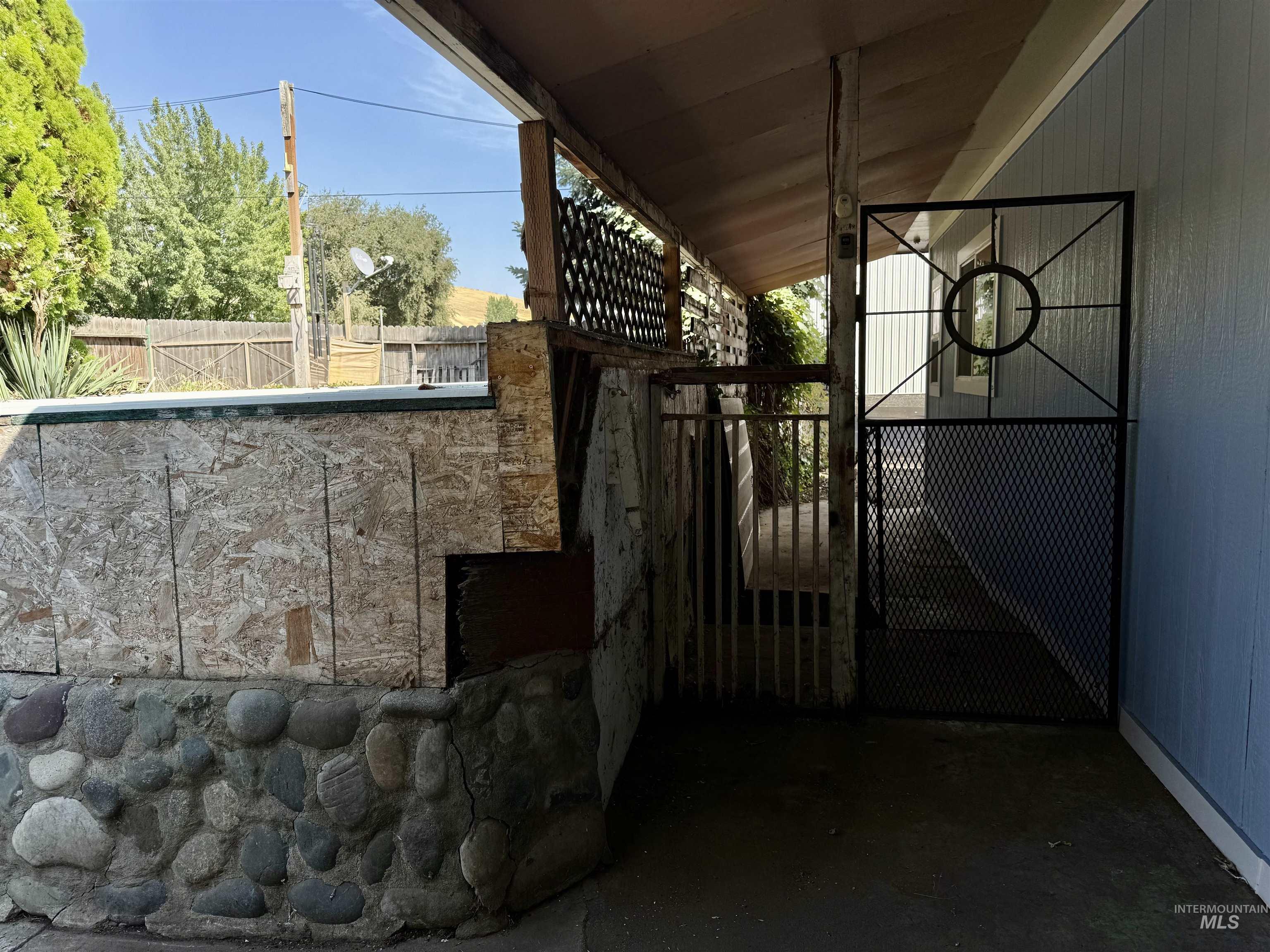 Gate featuring a patio