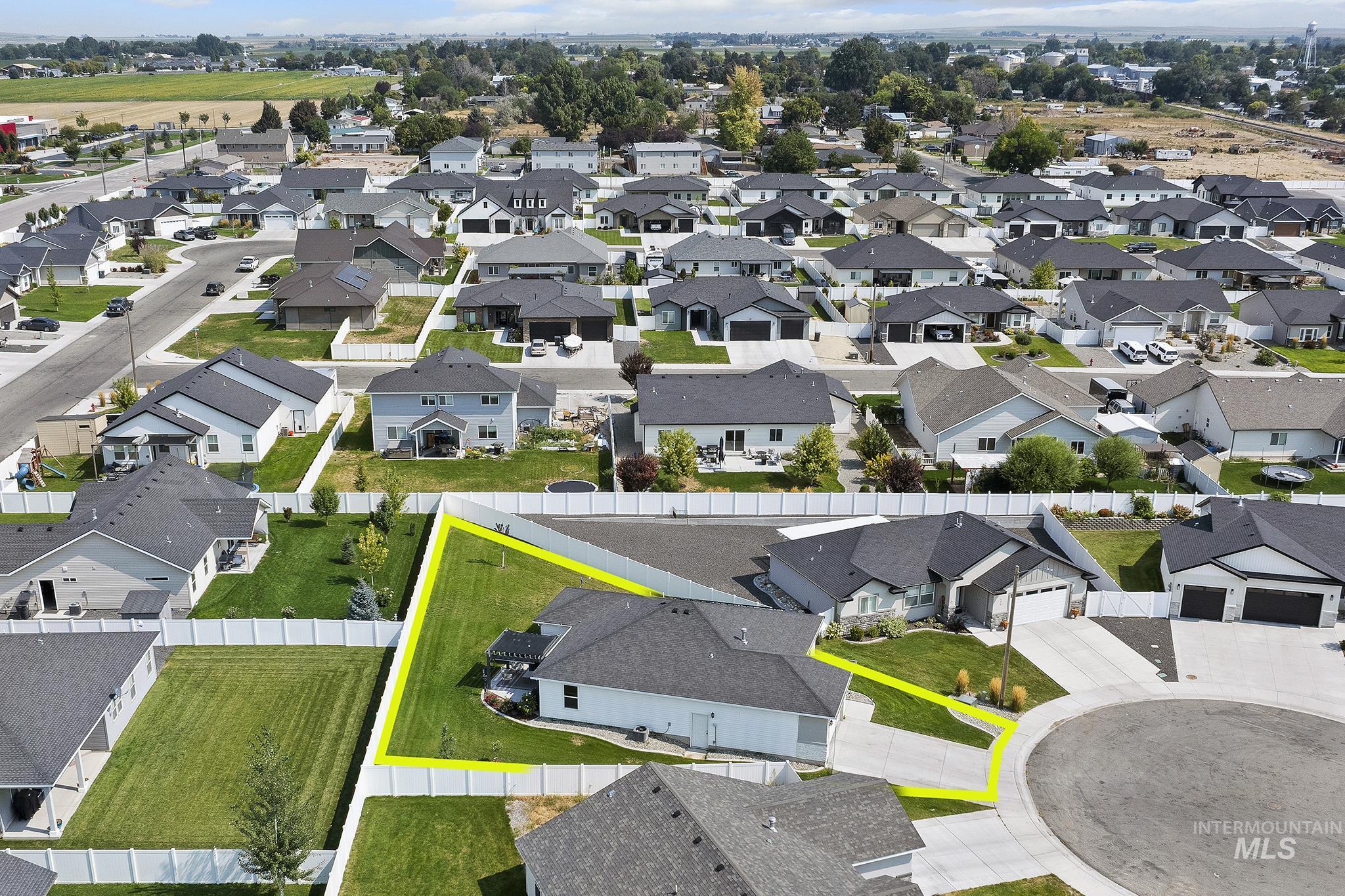 Aerial perspective of suburban area featuring property parcel outlined