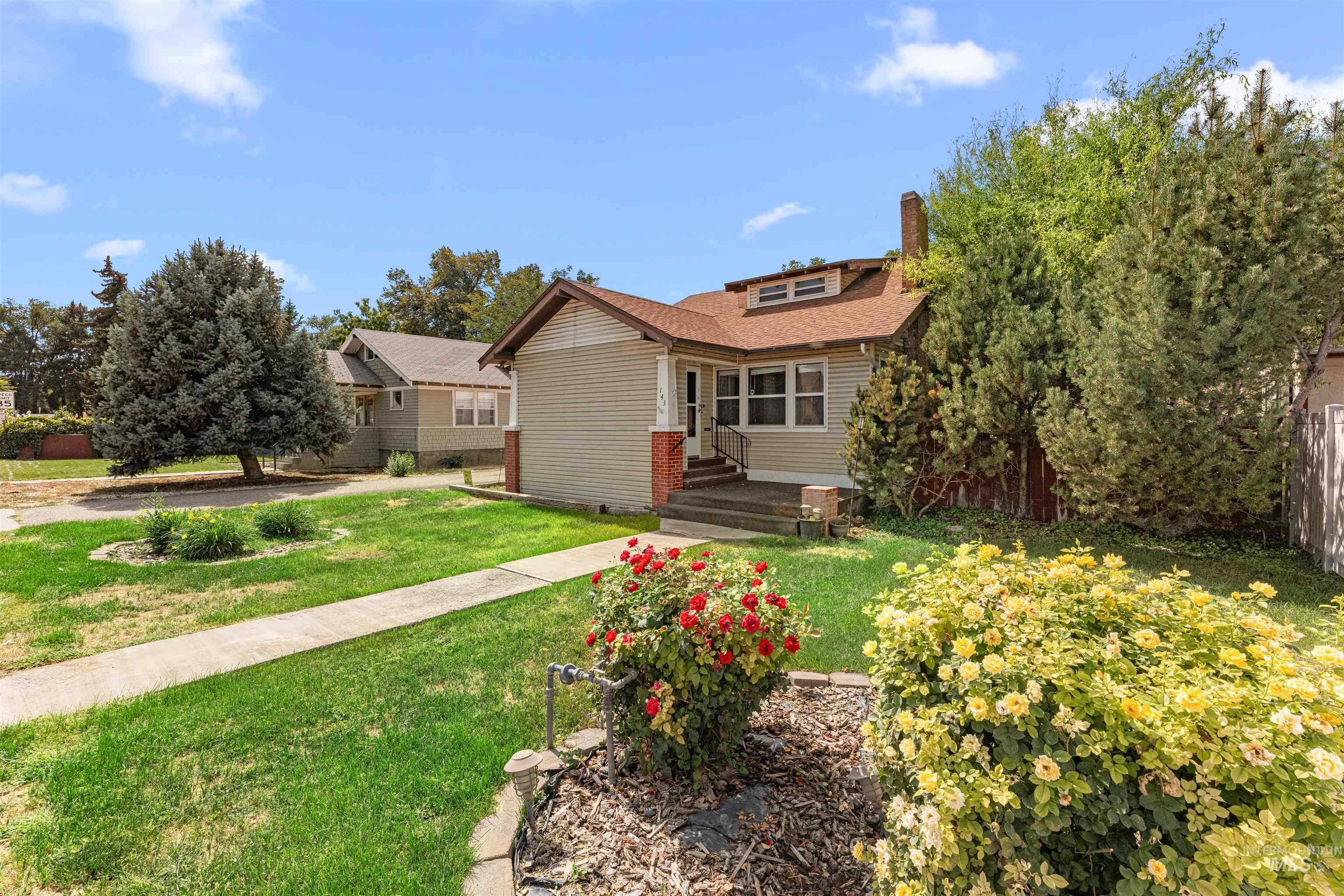 Bungalow-style home with a chimney