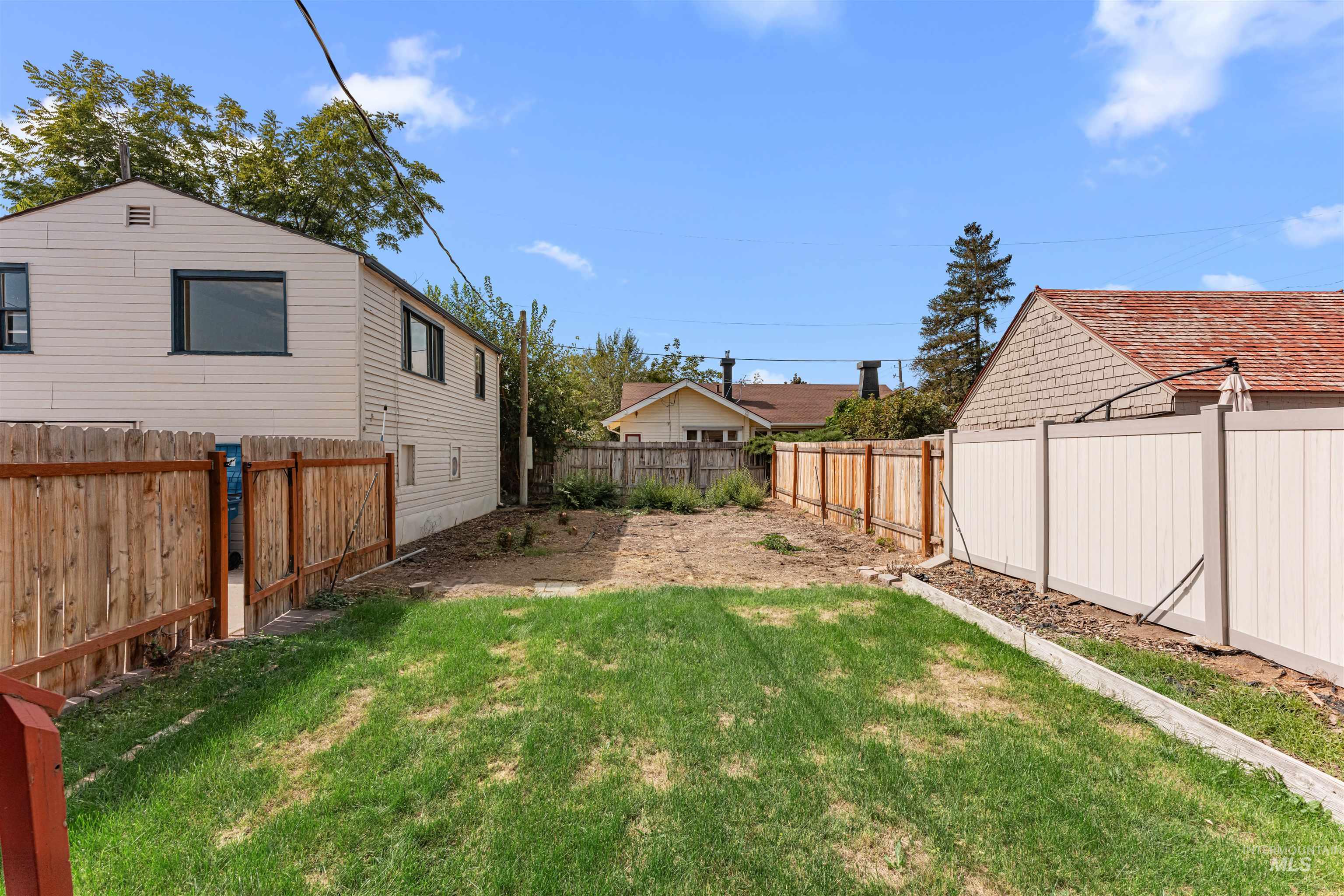 View of fenced backyard