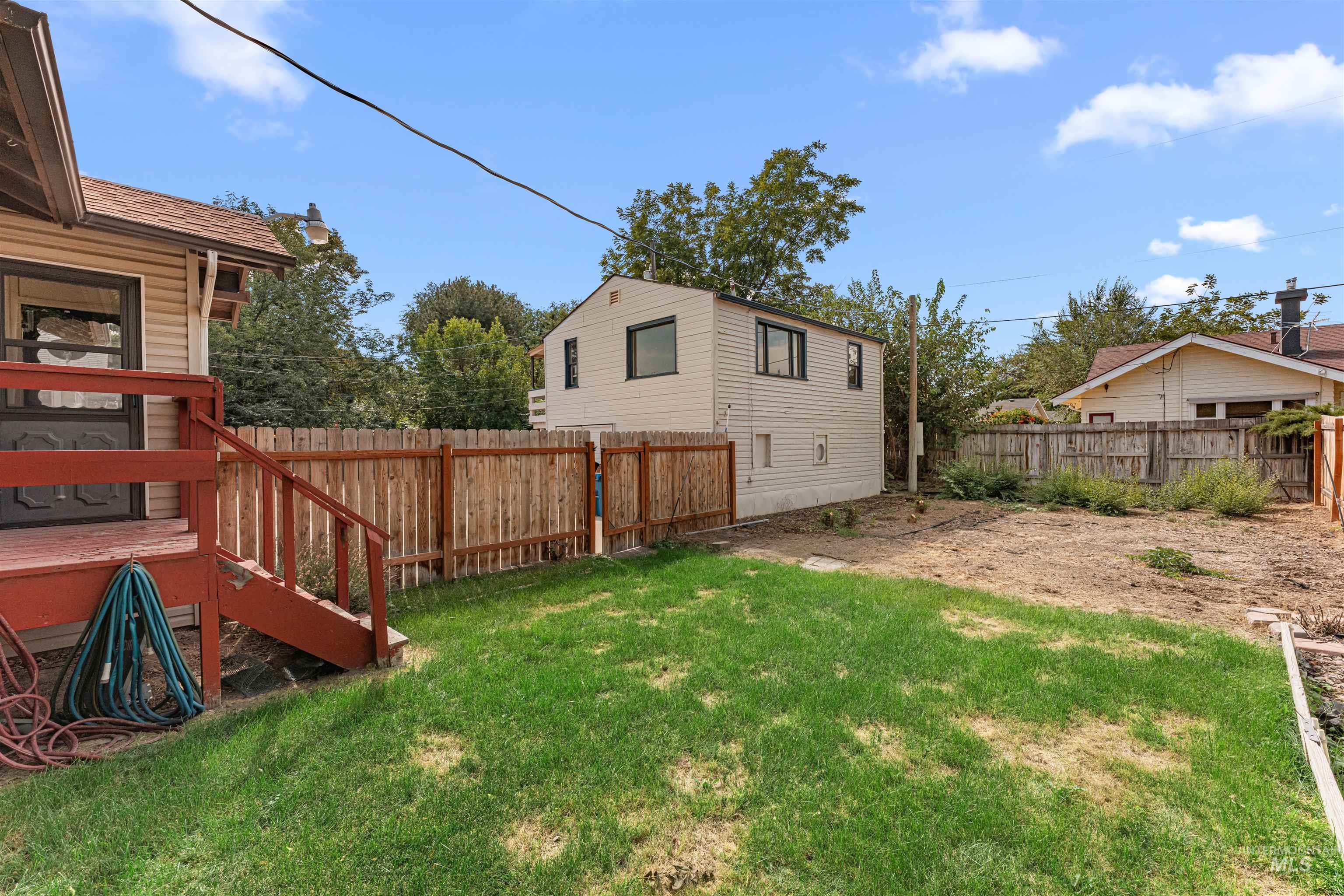 View of fenced backyard