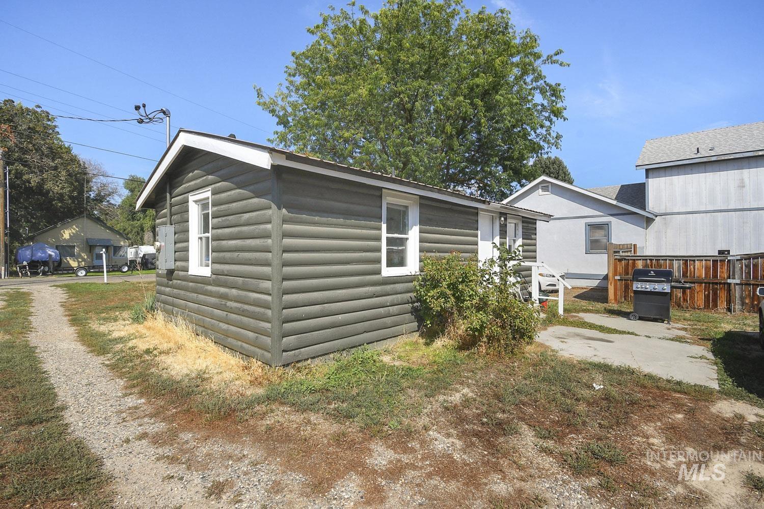 Rear view of house featuring faux log siding