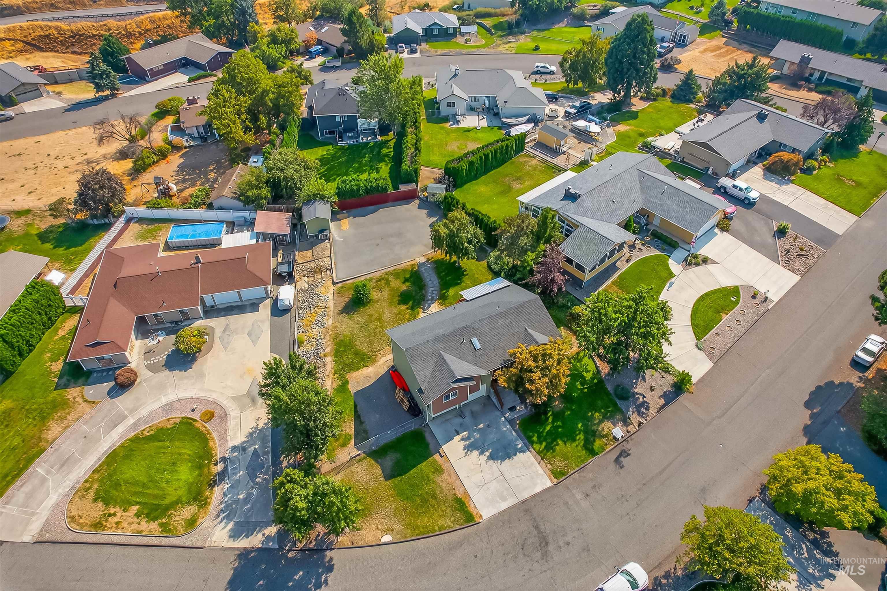 Aerial overview of property's location with nearby suburban area