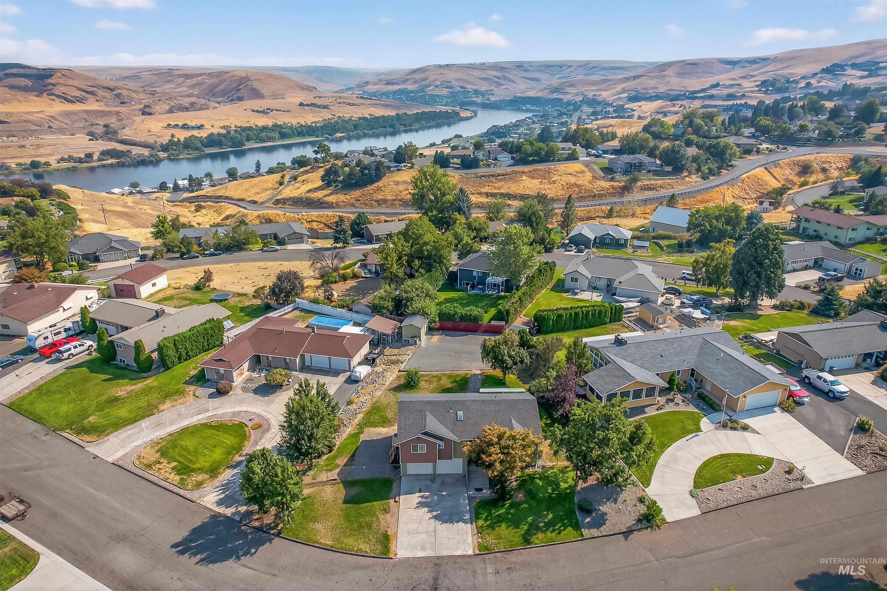 Aerial view of residential area with a water and mountain view