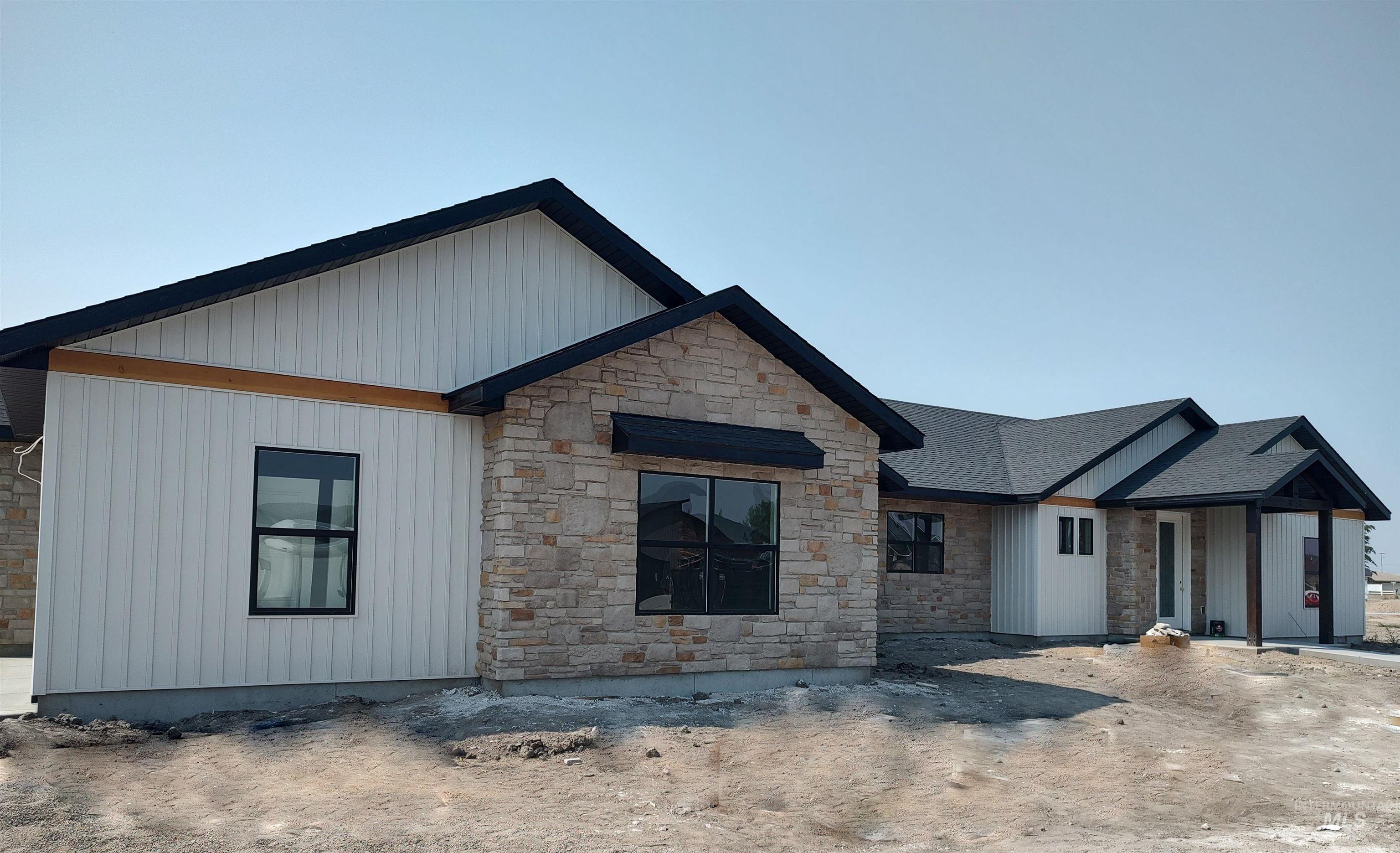 View of front of house with stone siding