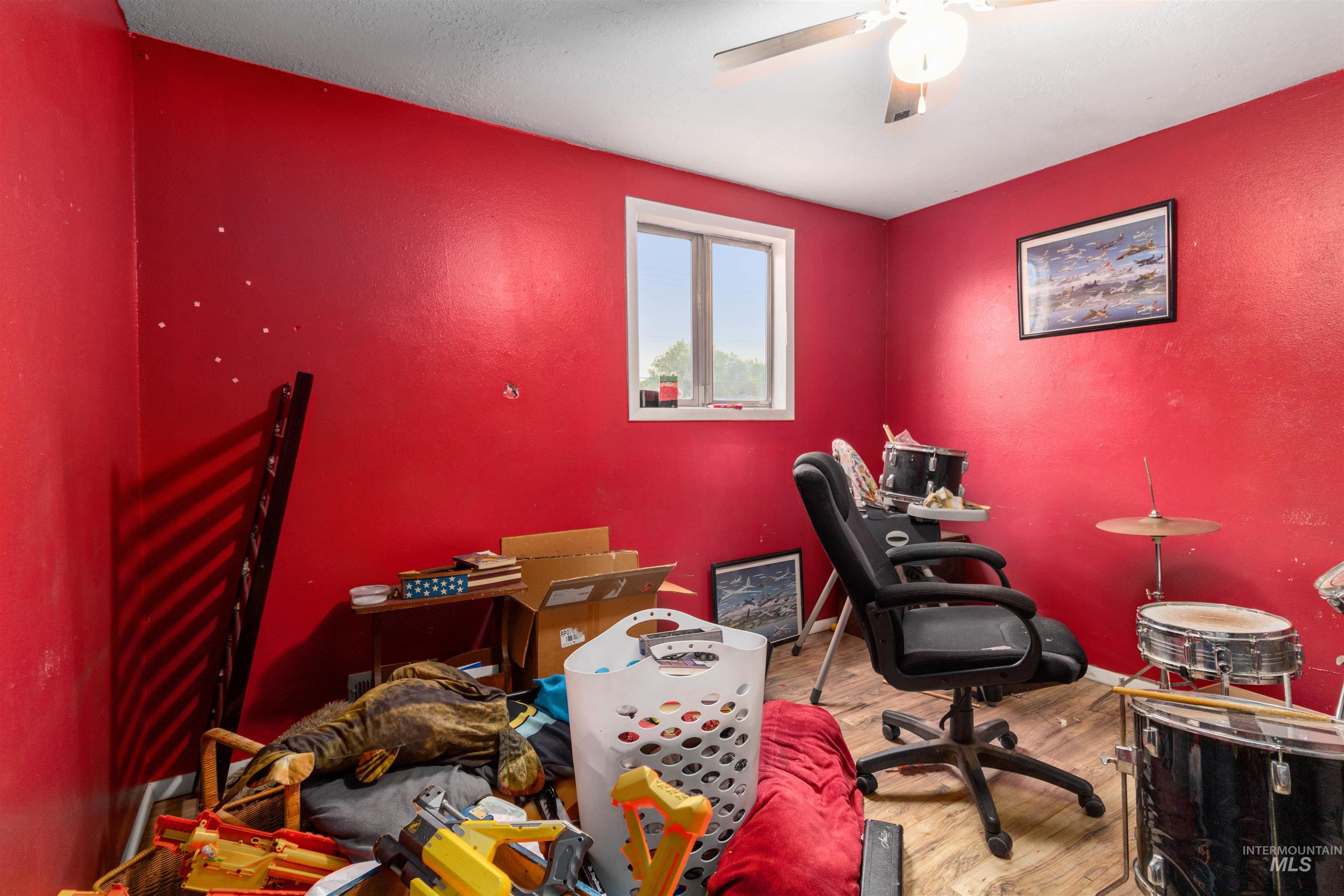 Office featuring wood finished floors and baseboards