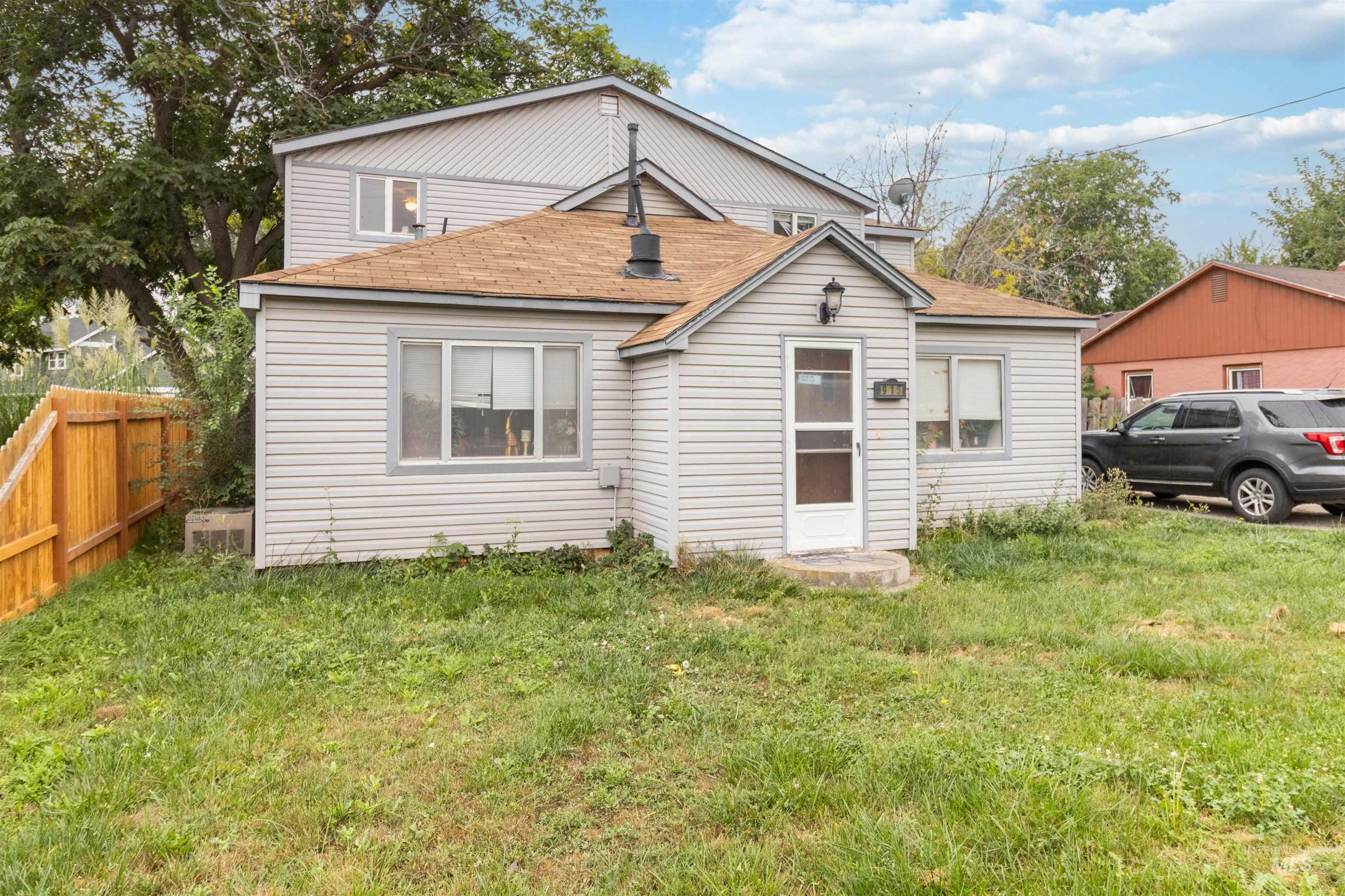 View of front of property featuring roof with shingles