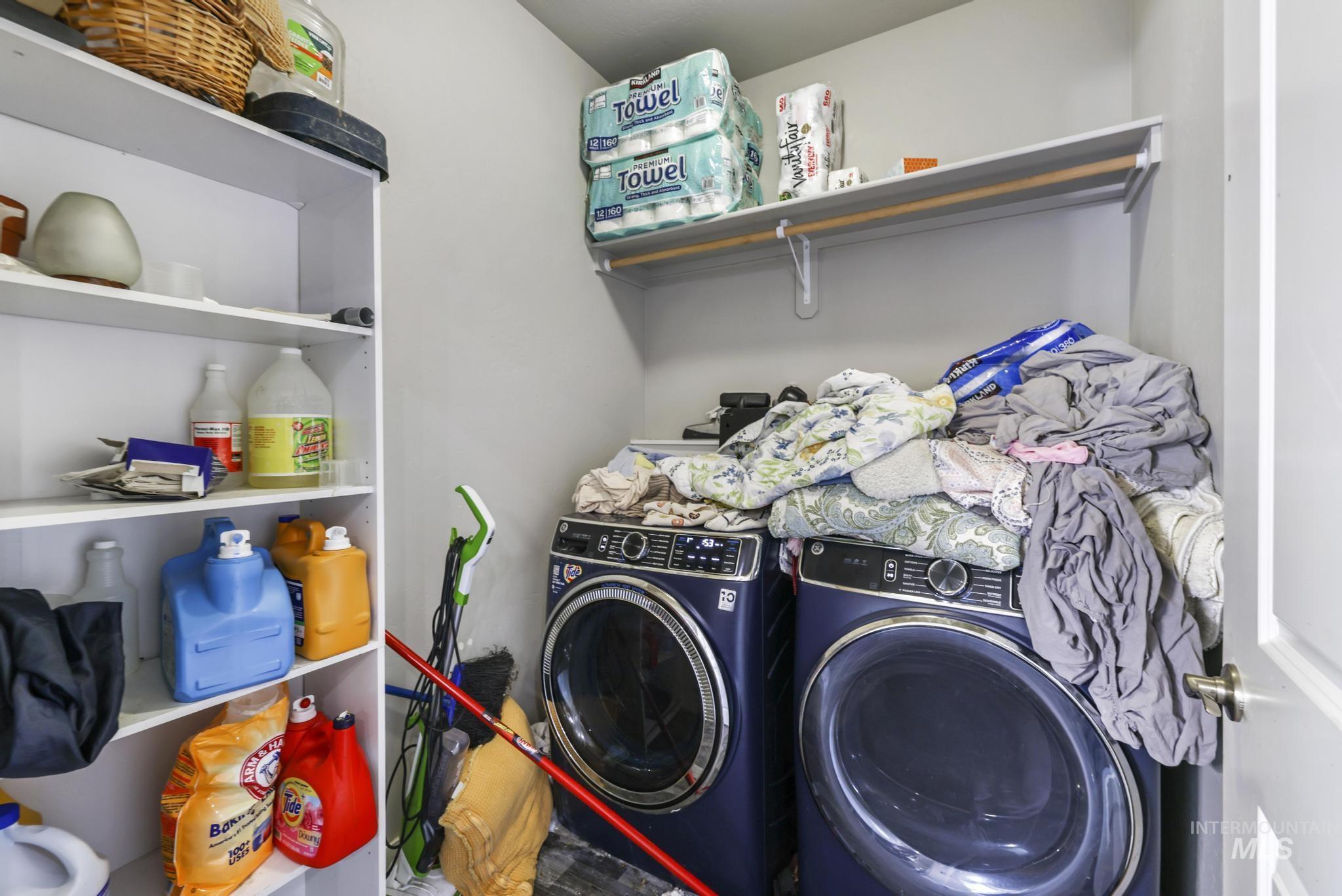 Laundry area featuring independent washer and dryer