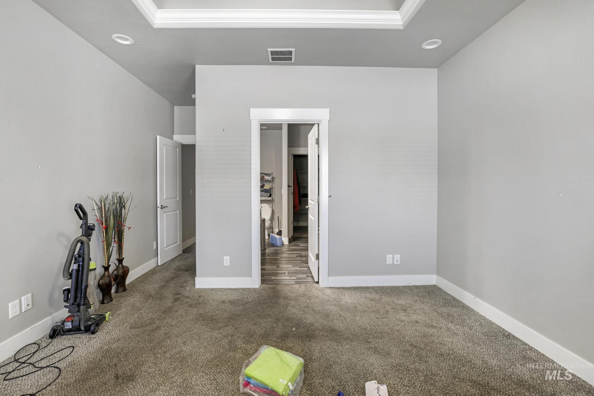 Unfurnished bedroom with carpet flooring, recessed lighting, and crown molding