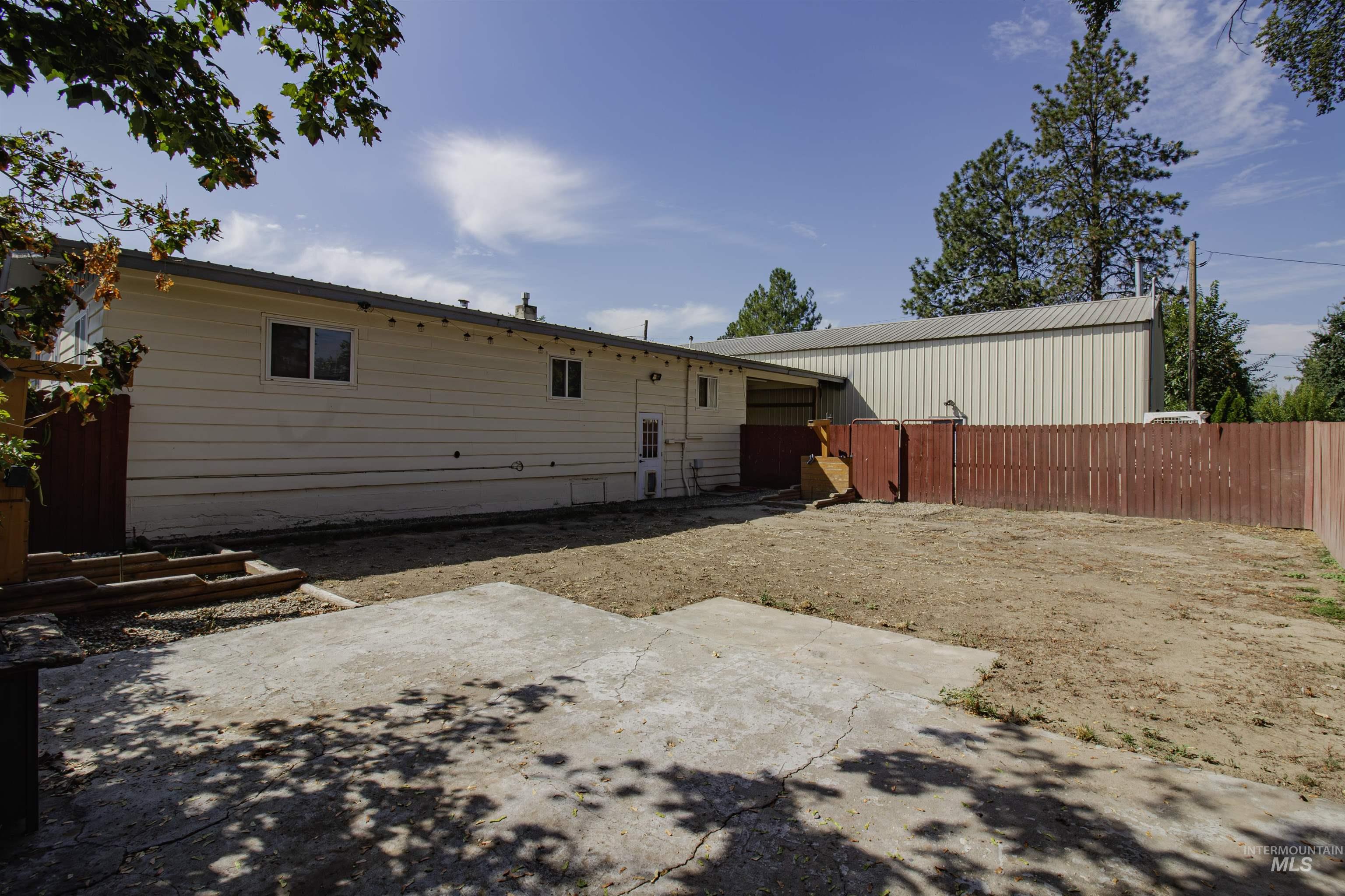 Rear view of property with a patio