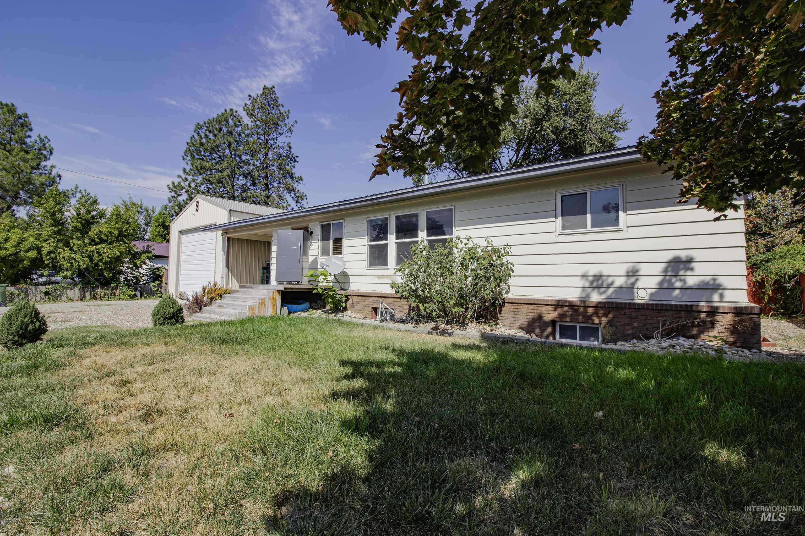 View of front of house featuring a front lawn