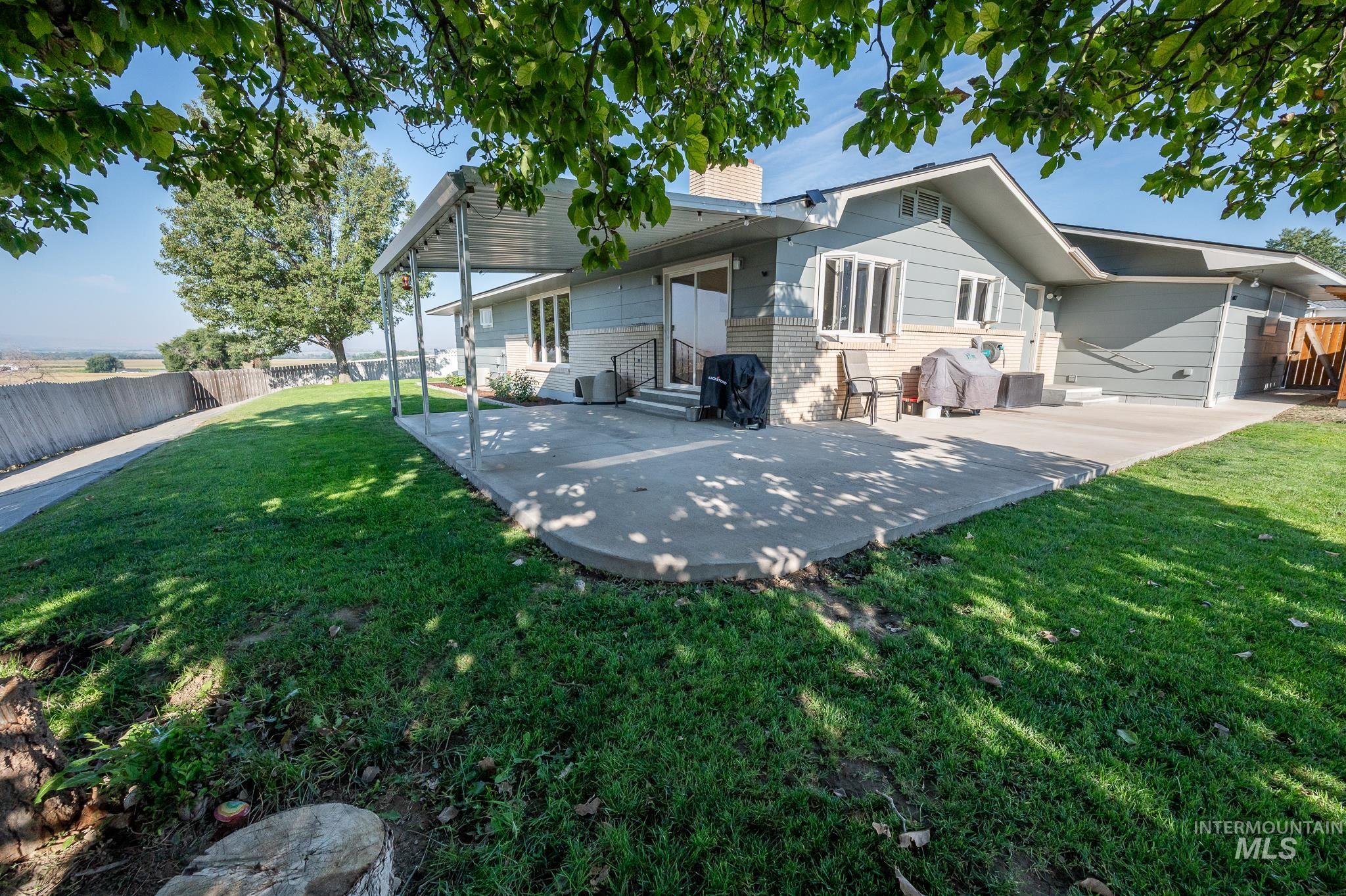 Back of house with a patio area and entry steps