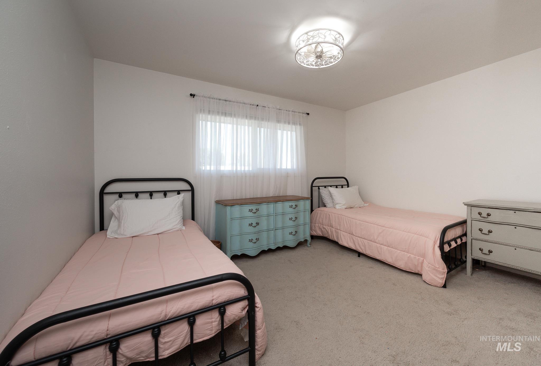 Bedroom with light carpet