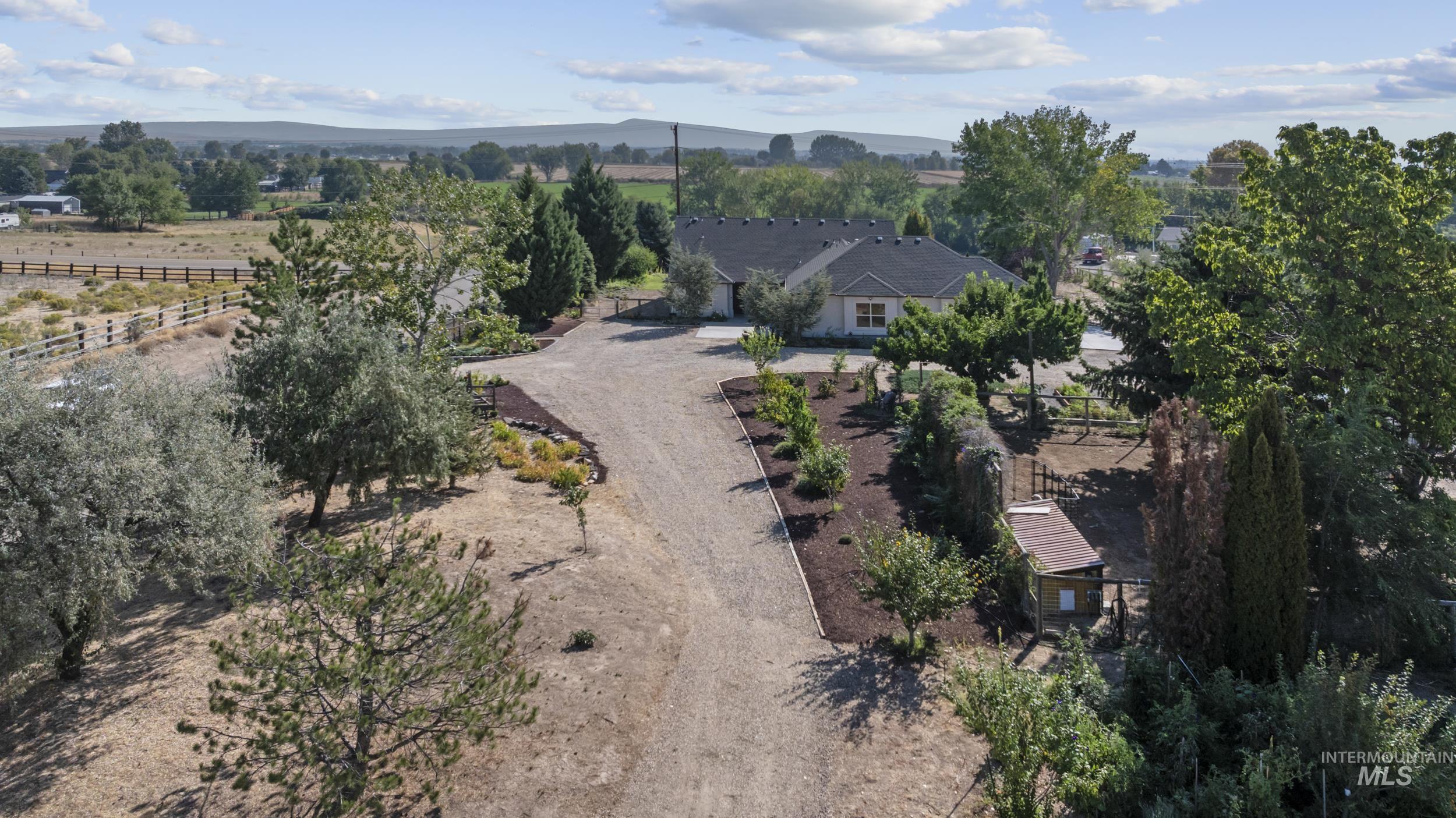 Aerial view of sparsely populated area with a mountainous background