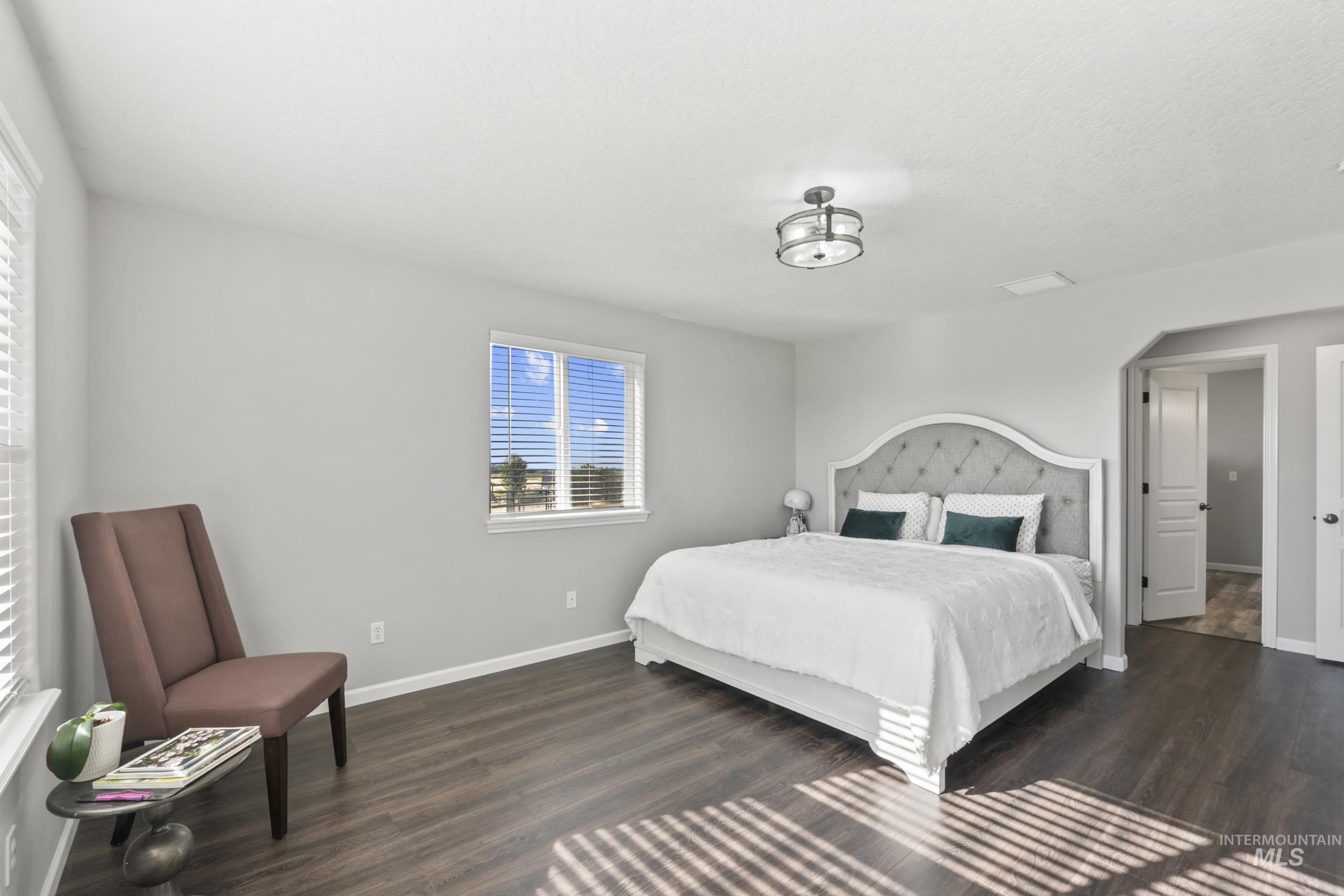 Bedroom featuring dark wood finished floors