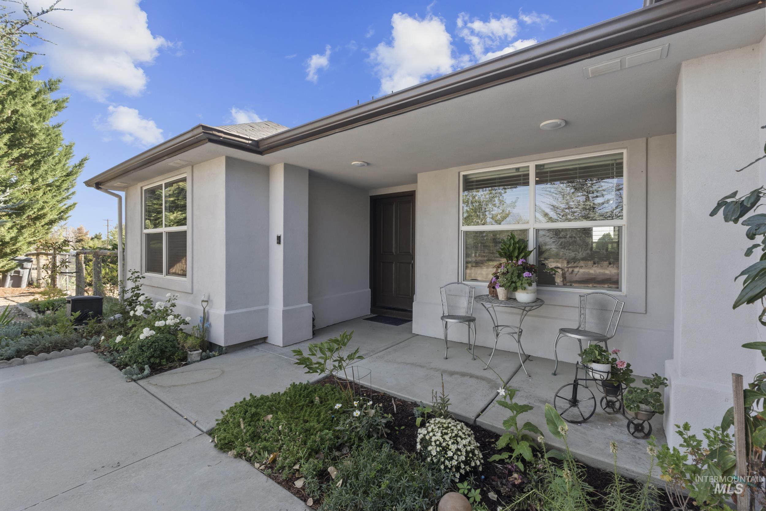 Doorway to property with stucco siding