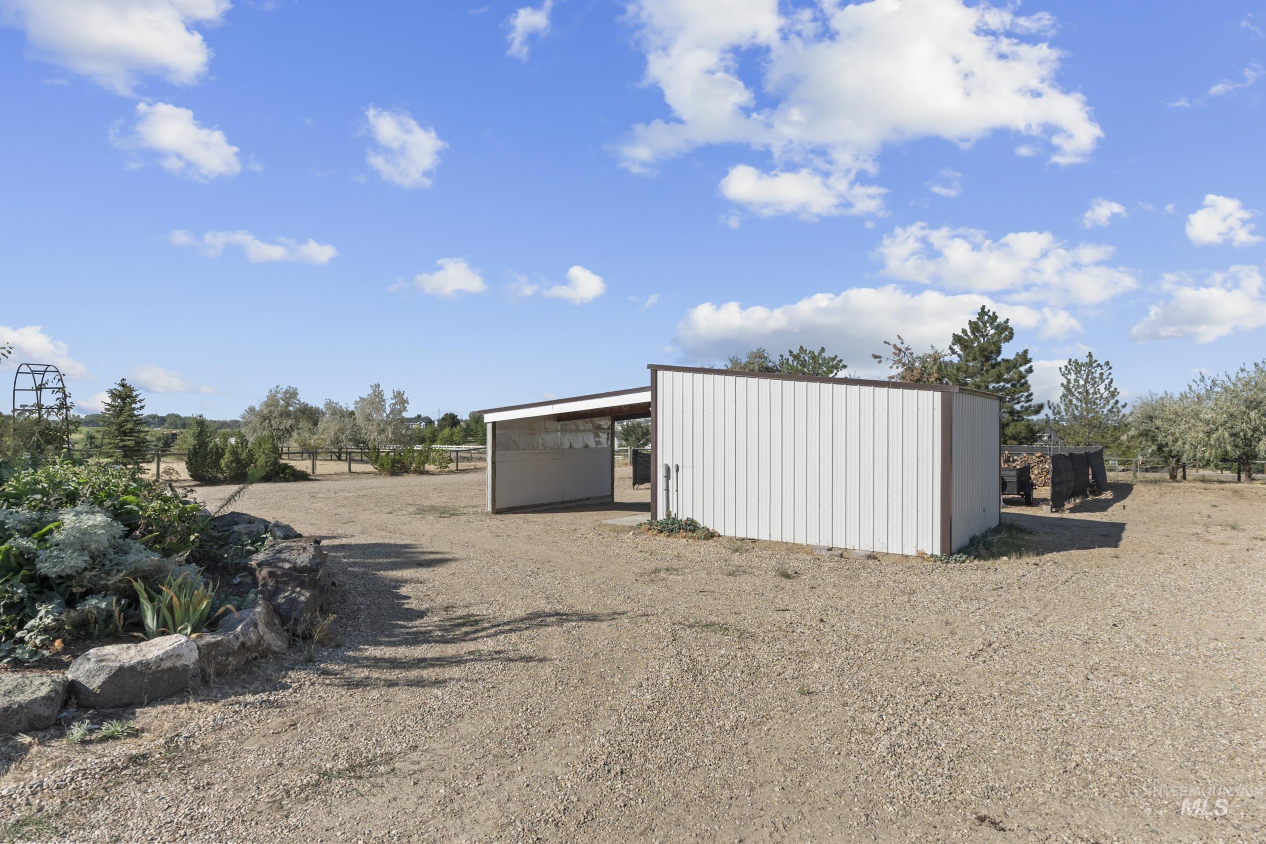 Heated tack room (or storage room) with covered parking