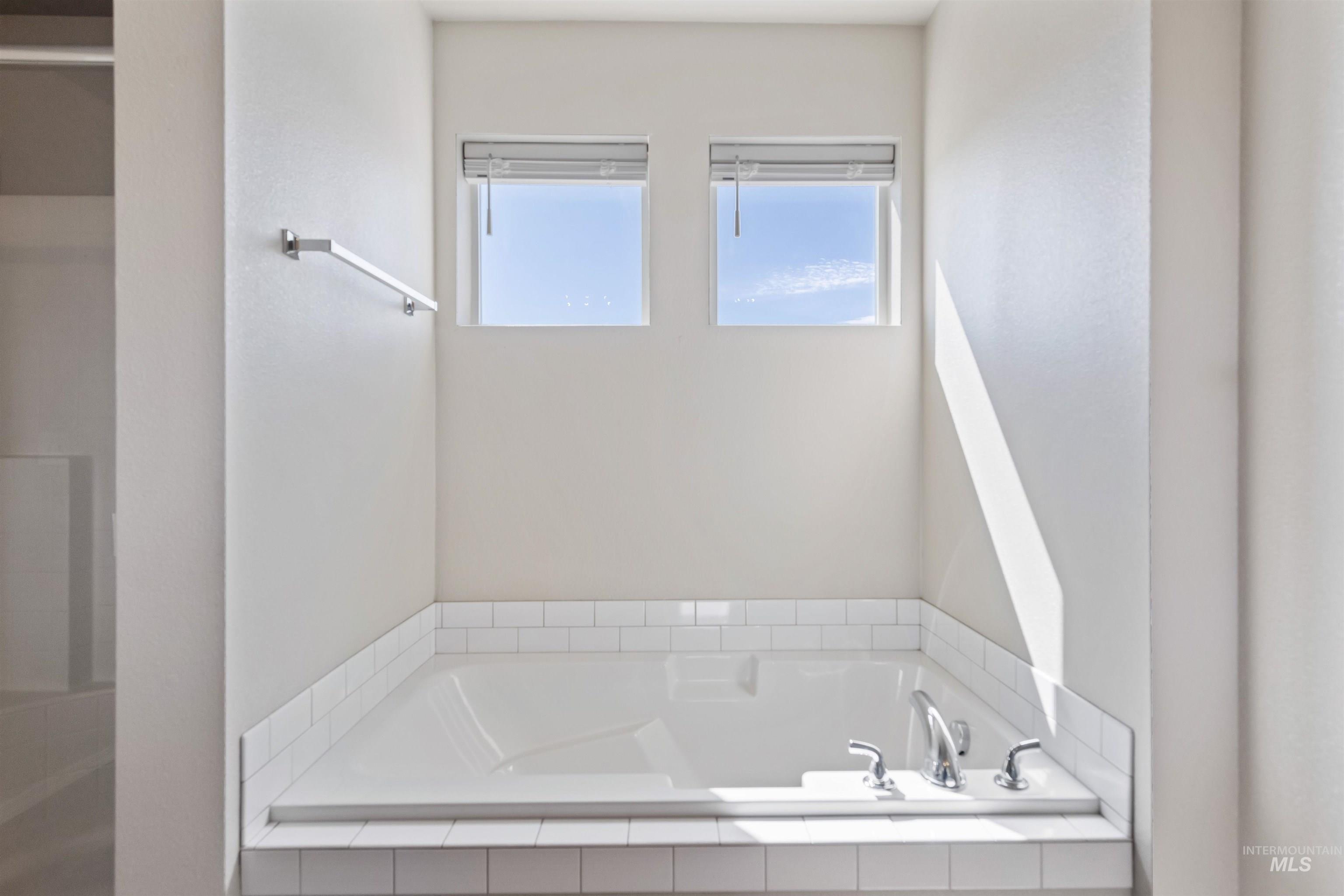 Full bathroom with a garden tub