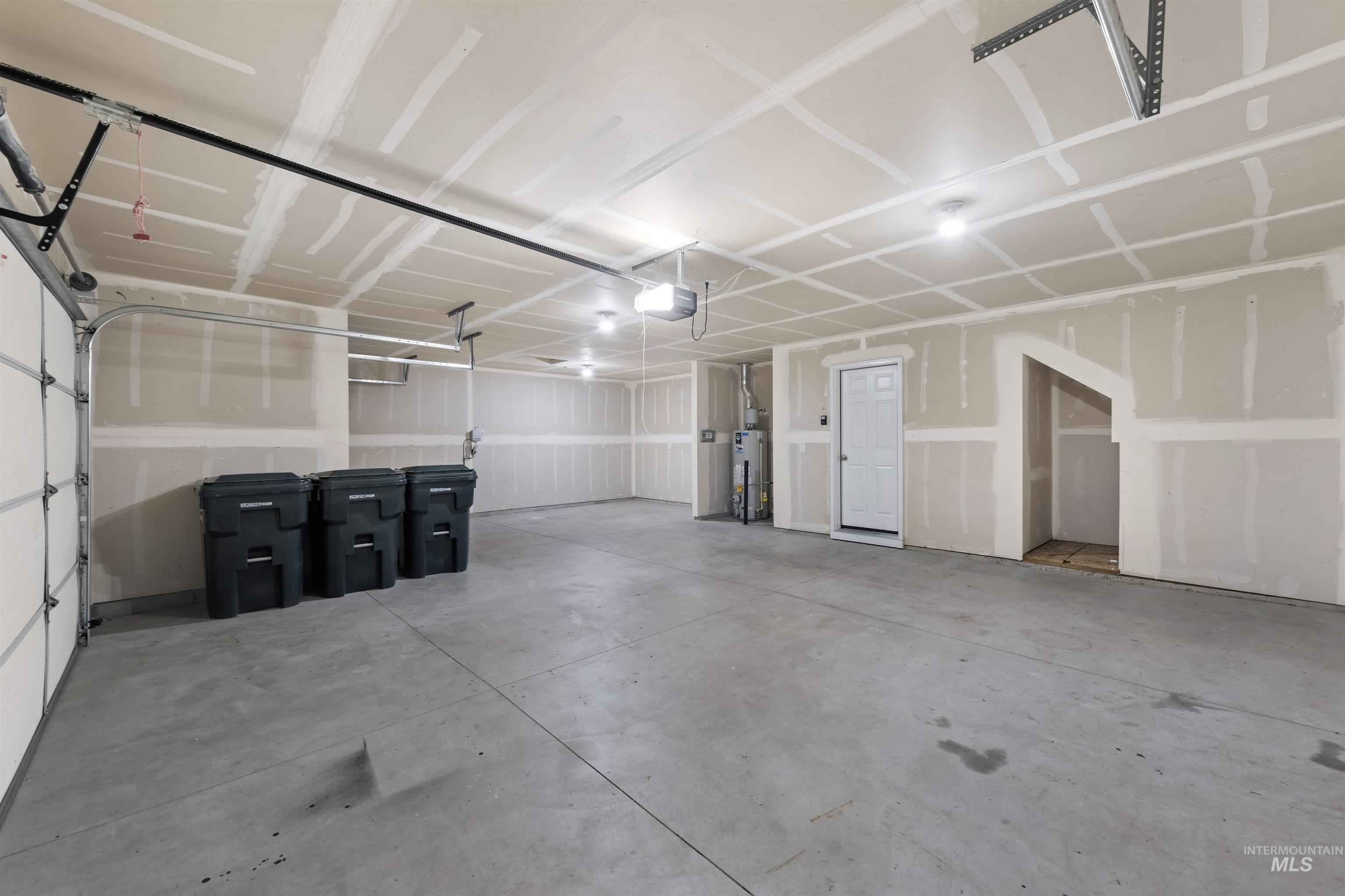Garage featuring water heater