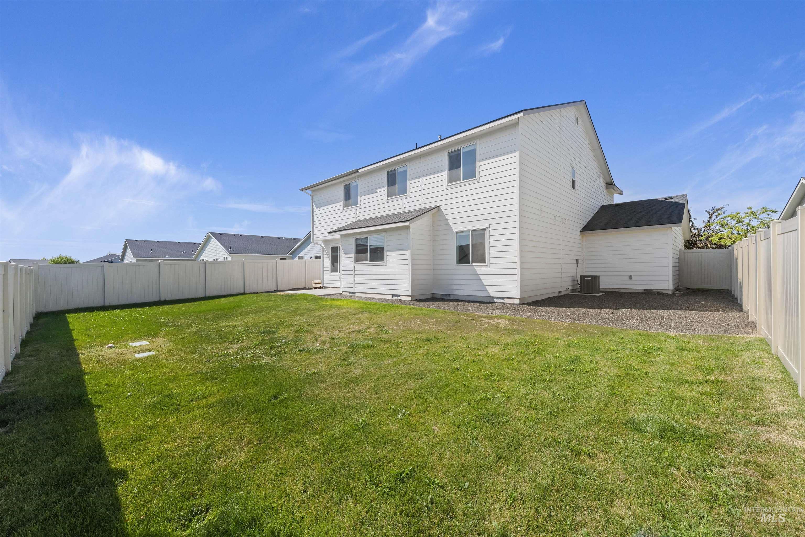 Back of house featuring a fenced backyard