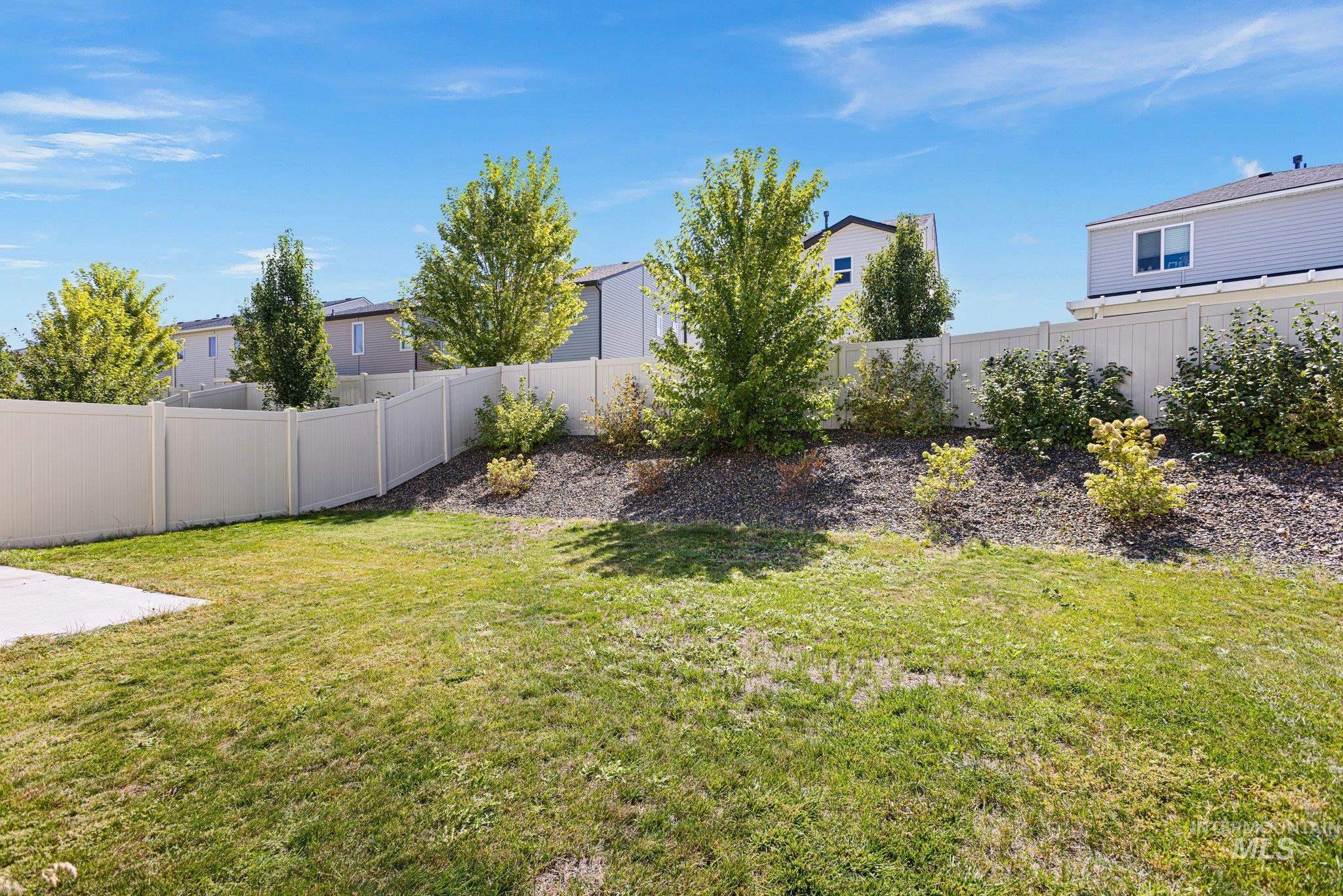 View of fenced backyard