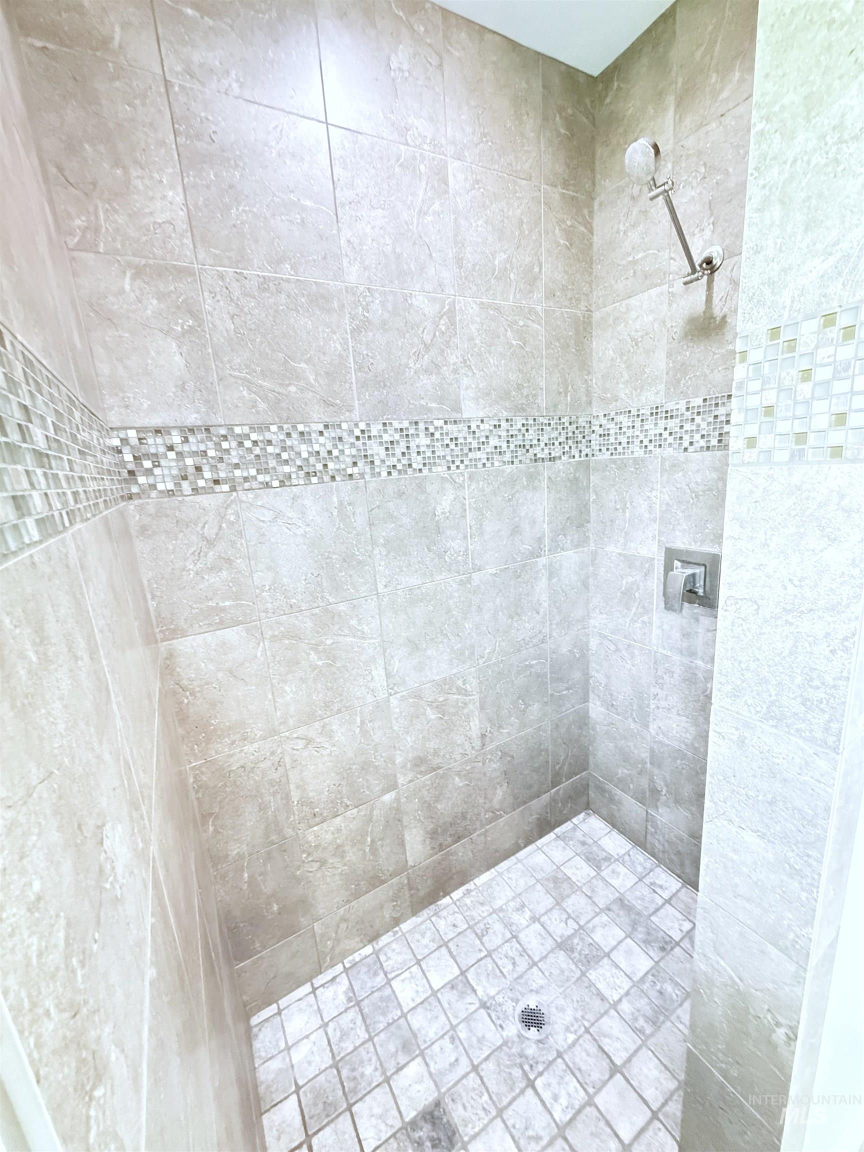 Full bathroom with tiled shower