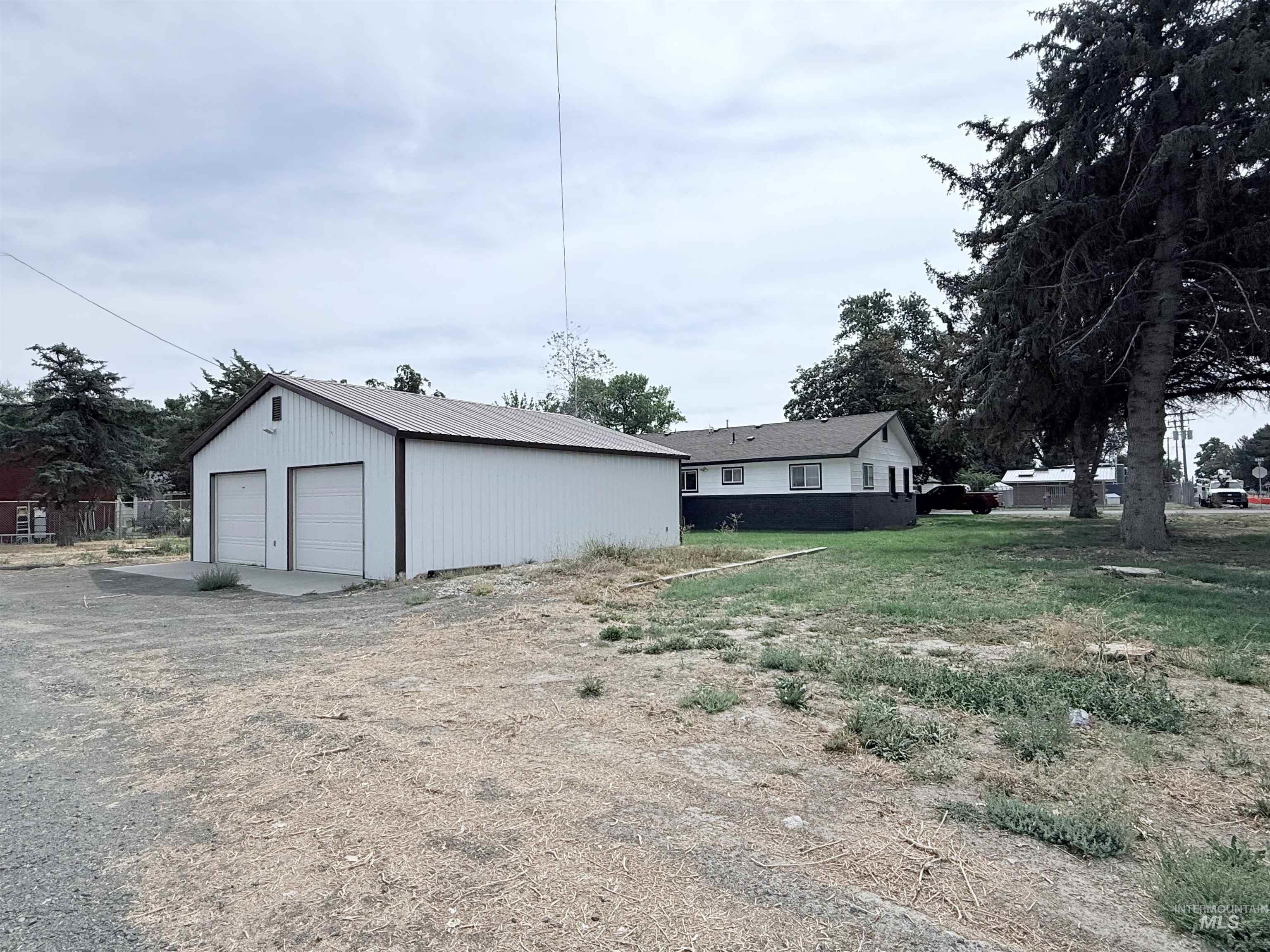 View of yard with an outbuilding and a detached garage