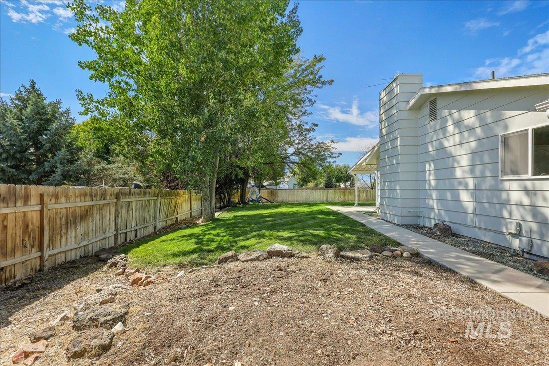 View of fenced backyard