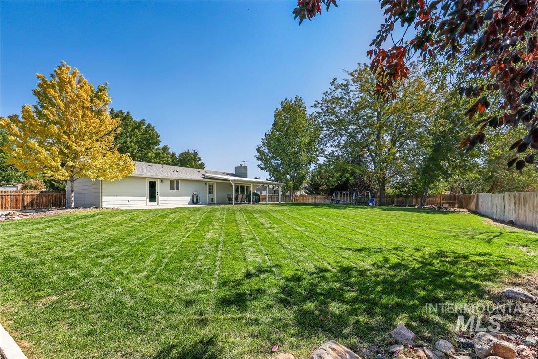 Fenced backyard featuring a patio area
