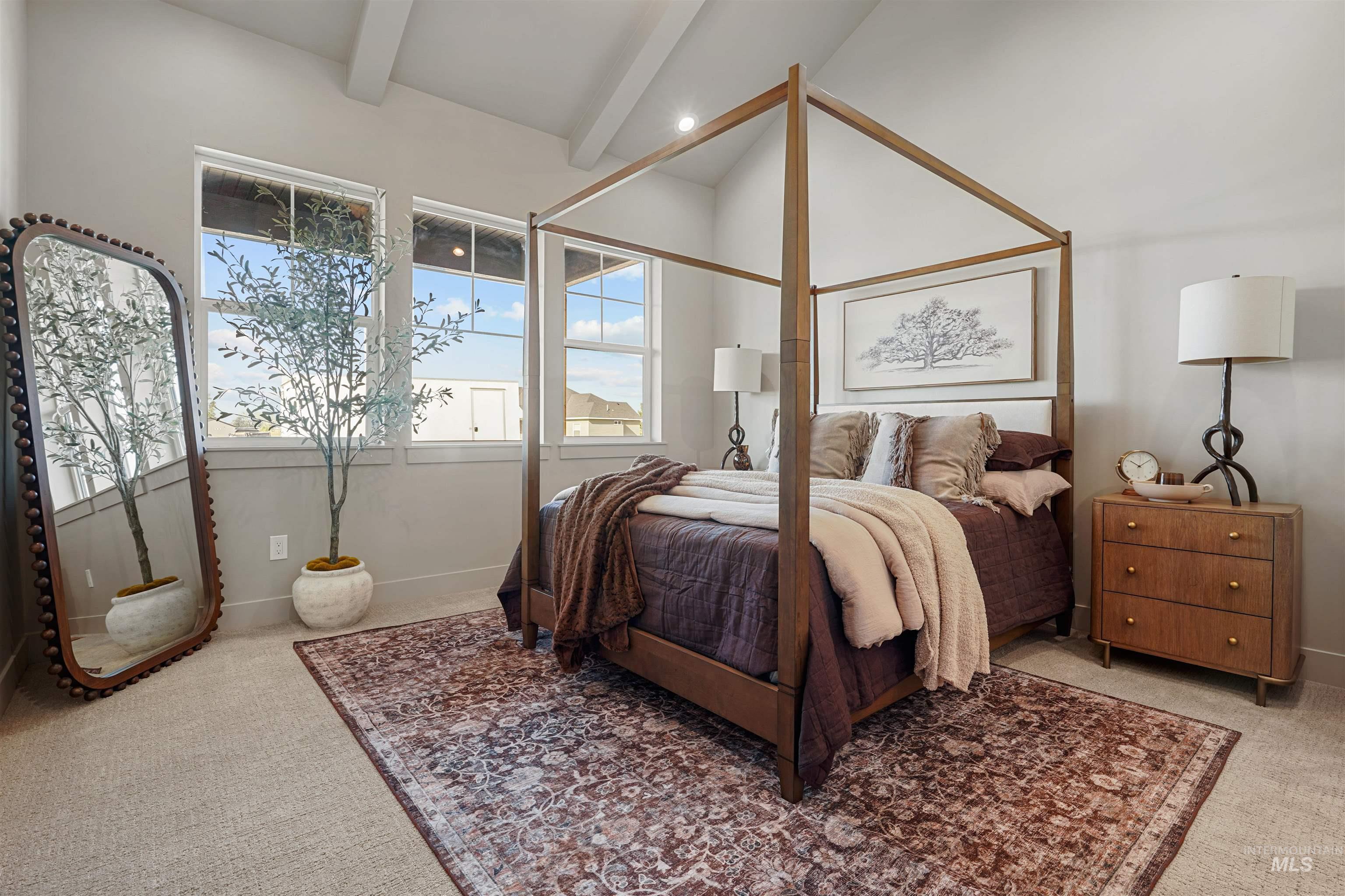 Bedroom featuring light colored carpet and baseboards