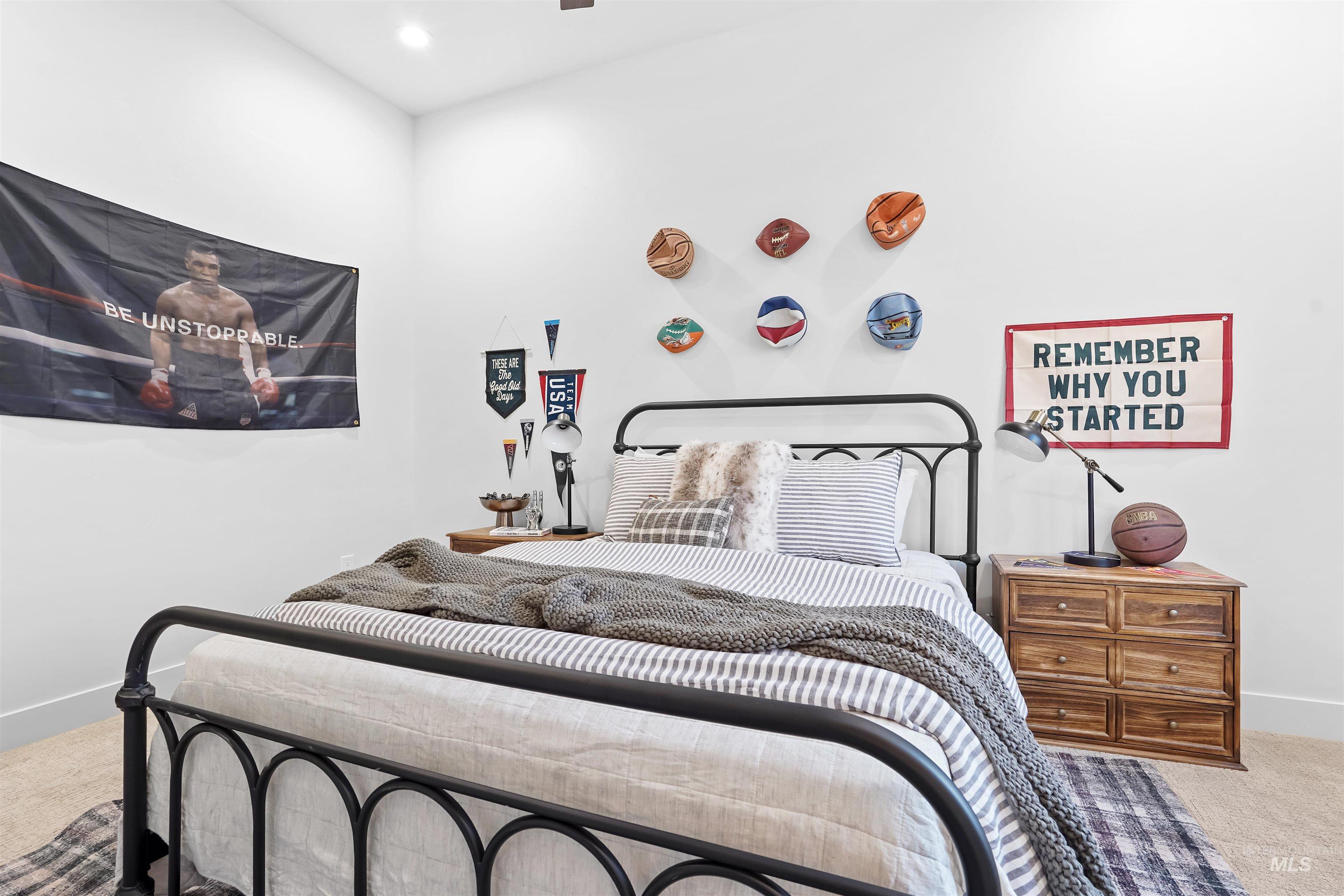Bedroom featuring light colored carpet