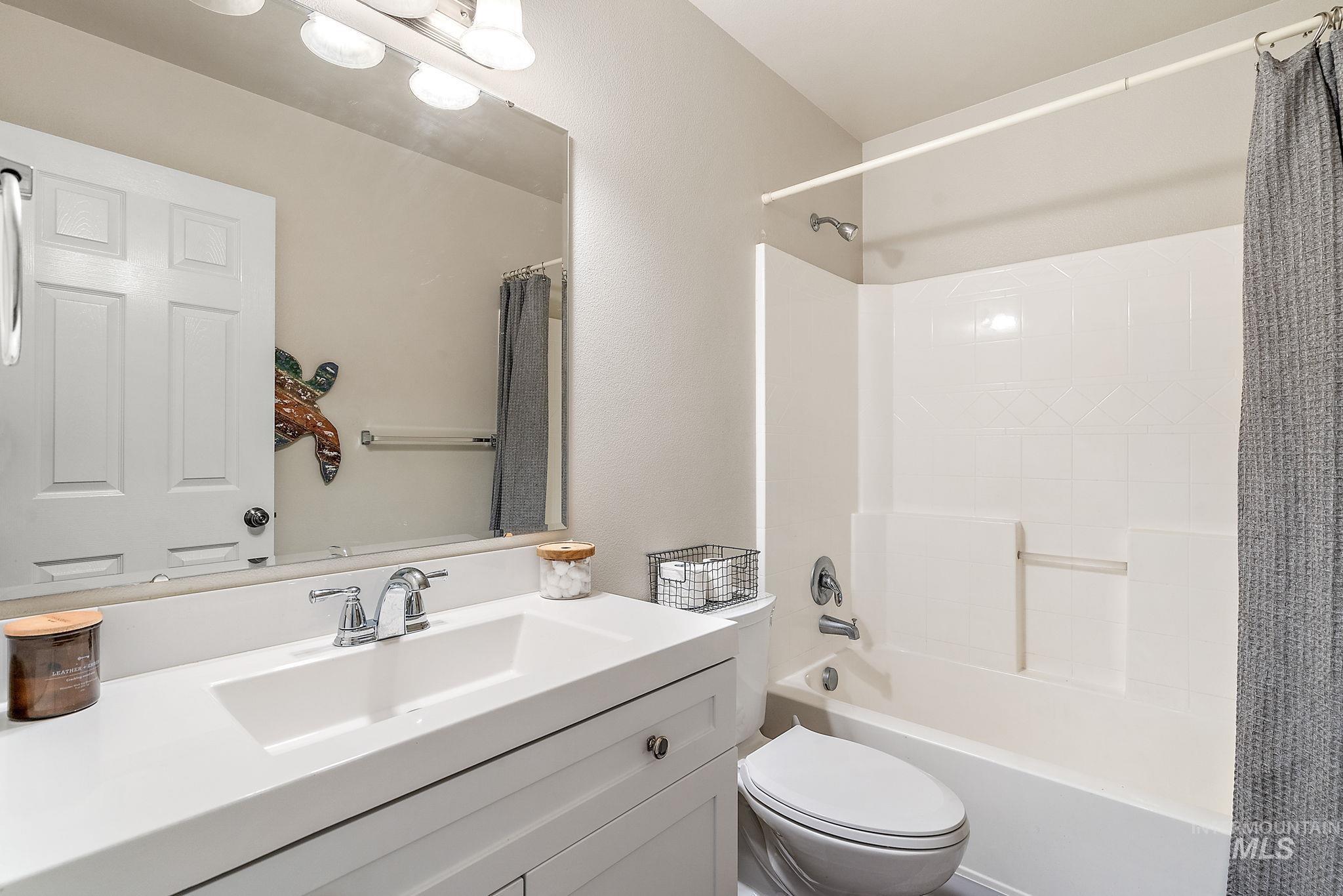 Full bathroom featuring vanity and shower / tub combo